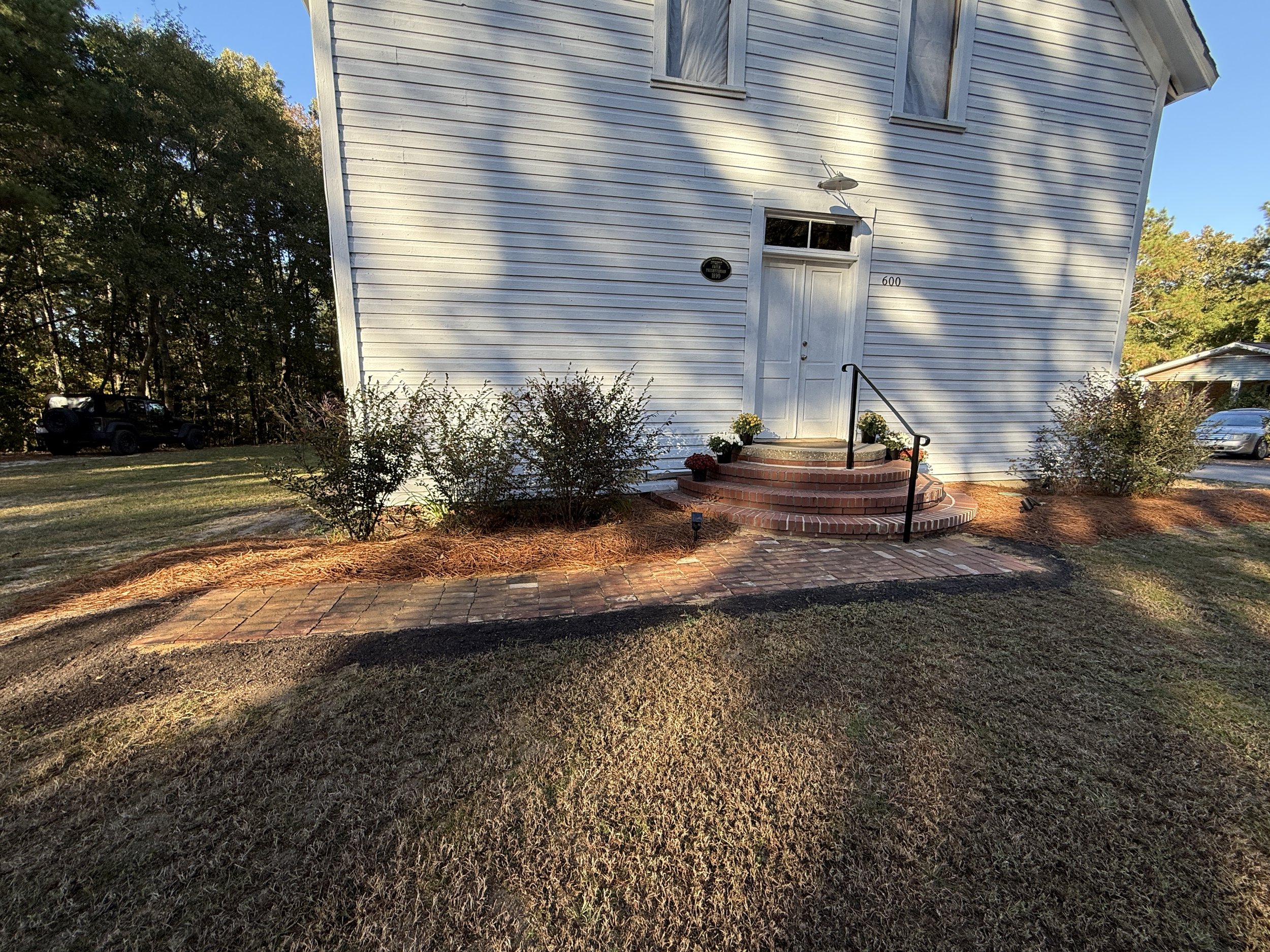 Bricks from chimney repurposed for walkway