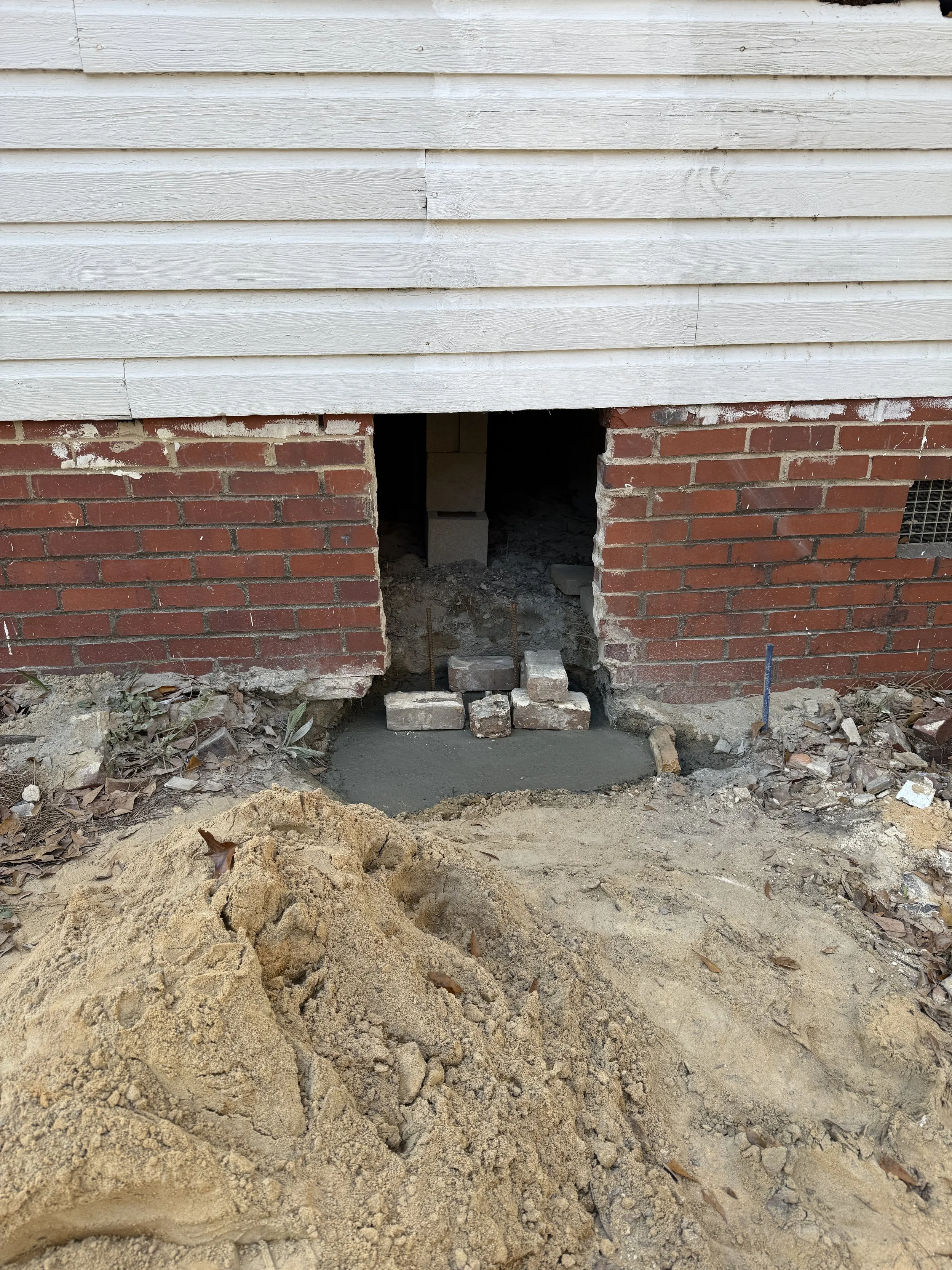 Foundation pier being refurbished