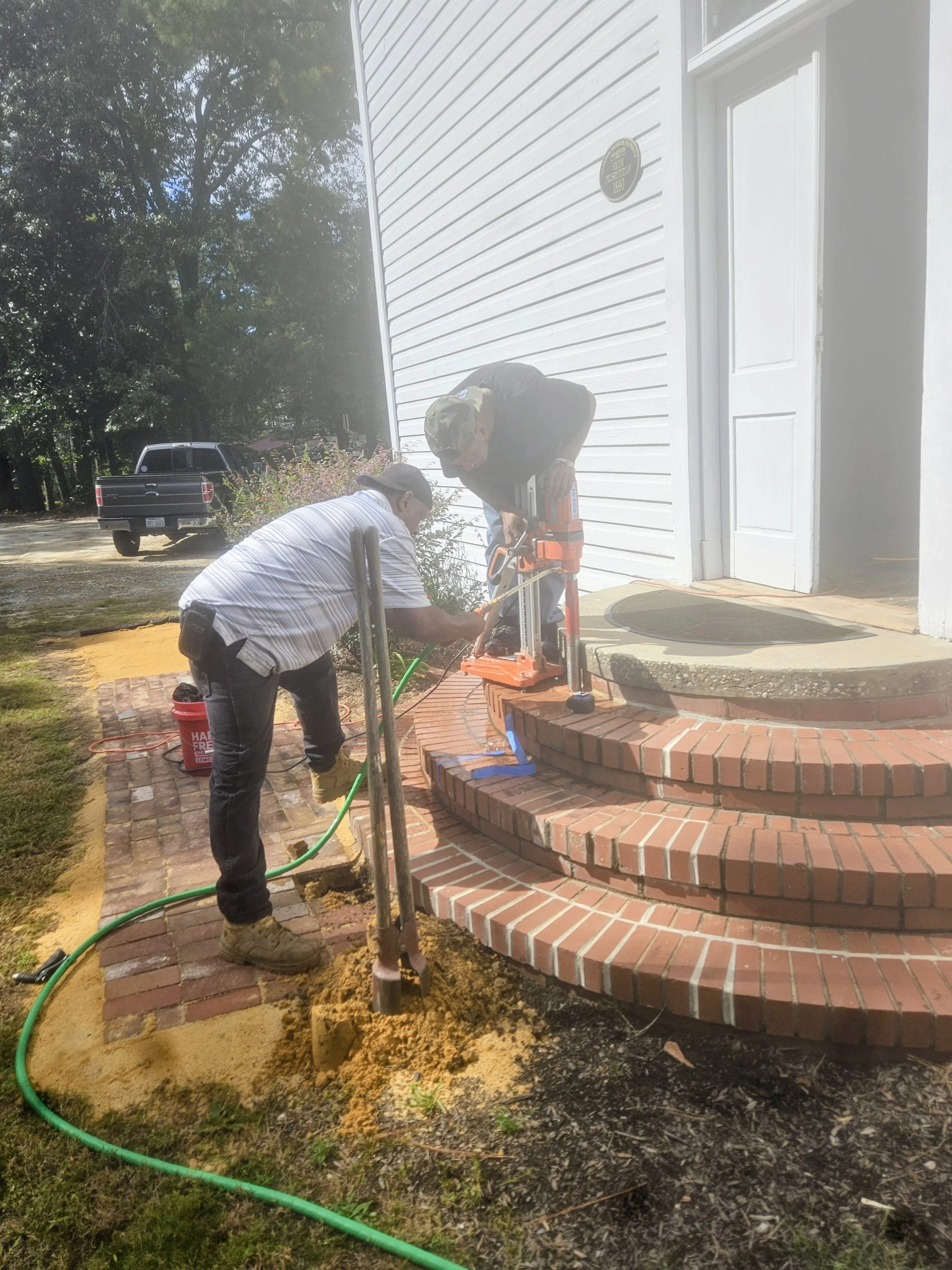 Handrail on front step being installed