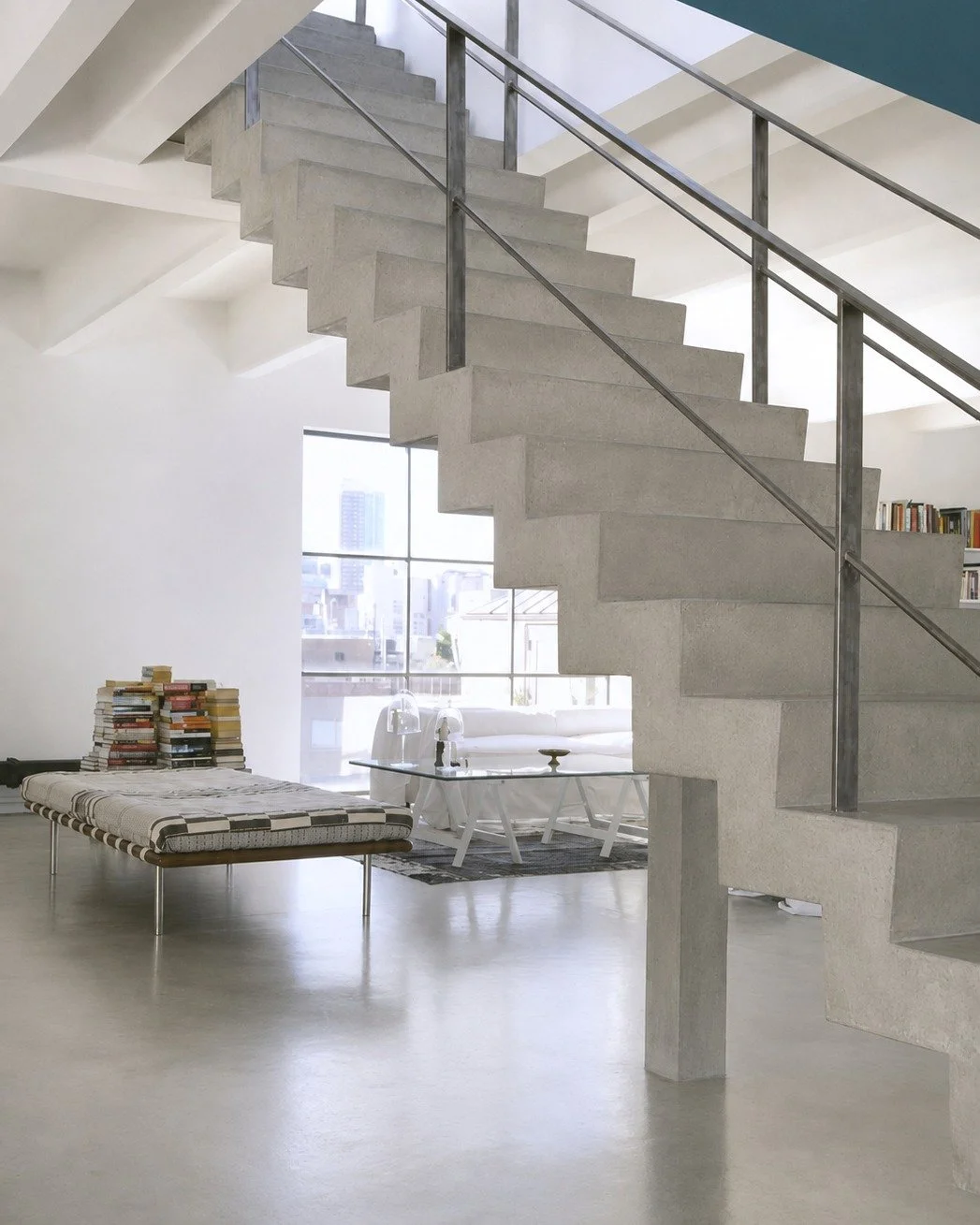 The floor in this space is Wall2Floor, a seamless mineral system that goes on site with no tiles, no grout lines and no seams, and then gets sealed to whatever finish level the project calls for.

It is one of those choices that looks quiet but chang