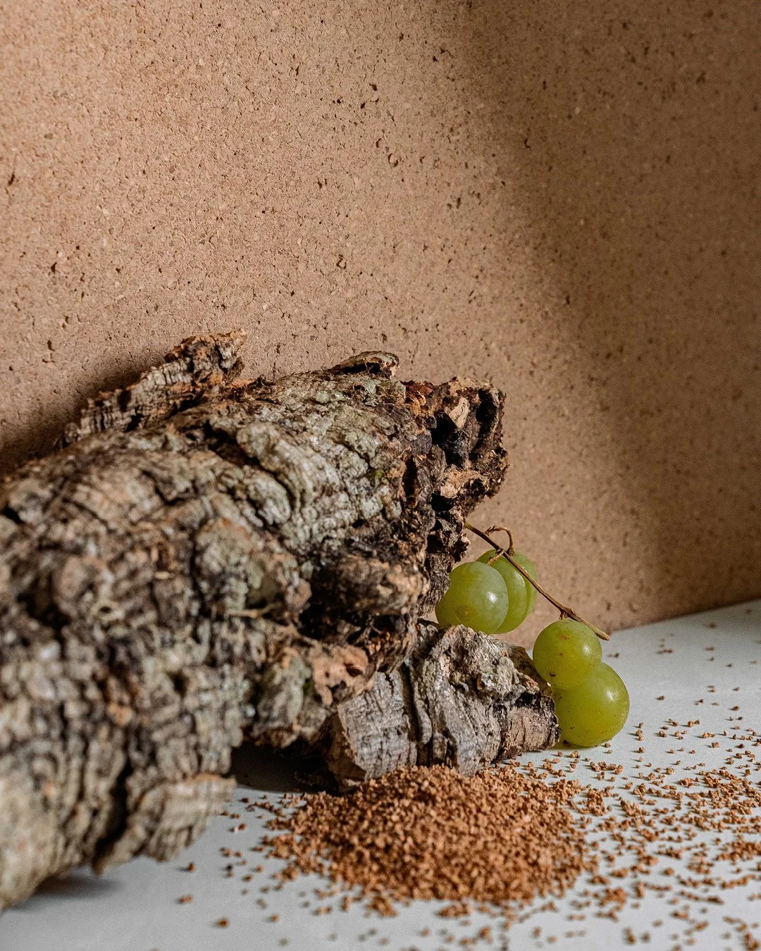 Put a cork in it! Literally, in this case.

Materia Viva Sughero mixes real cork granules into a mineral plaster base, then the whole surface gets sanded once it's dry so every fleck and fiber actually shows. It's one of six ways Novacolor blends thi