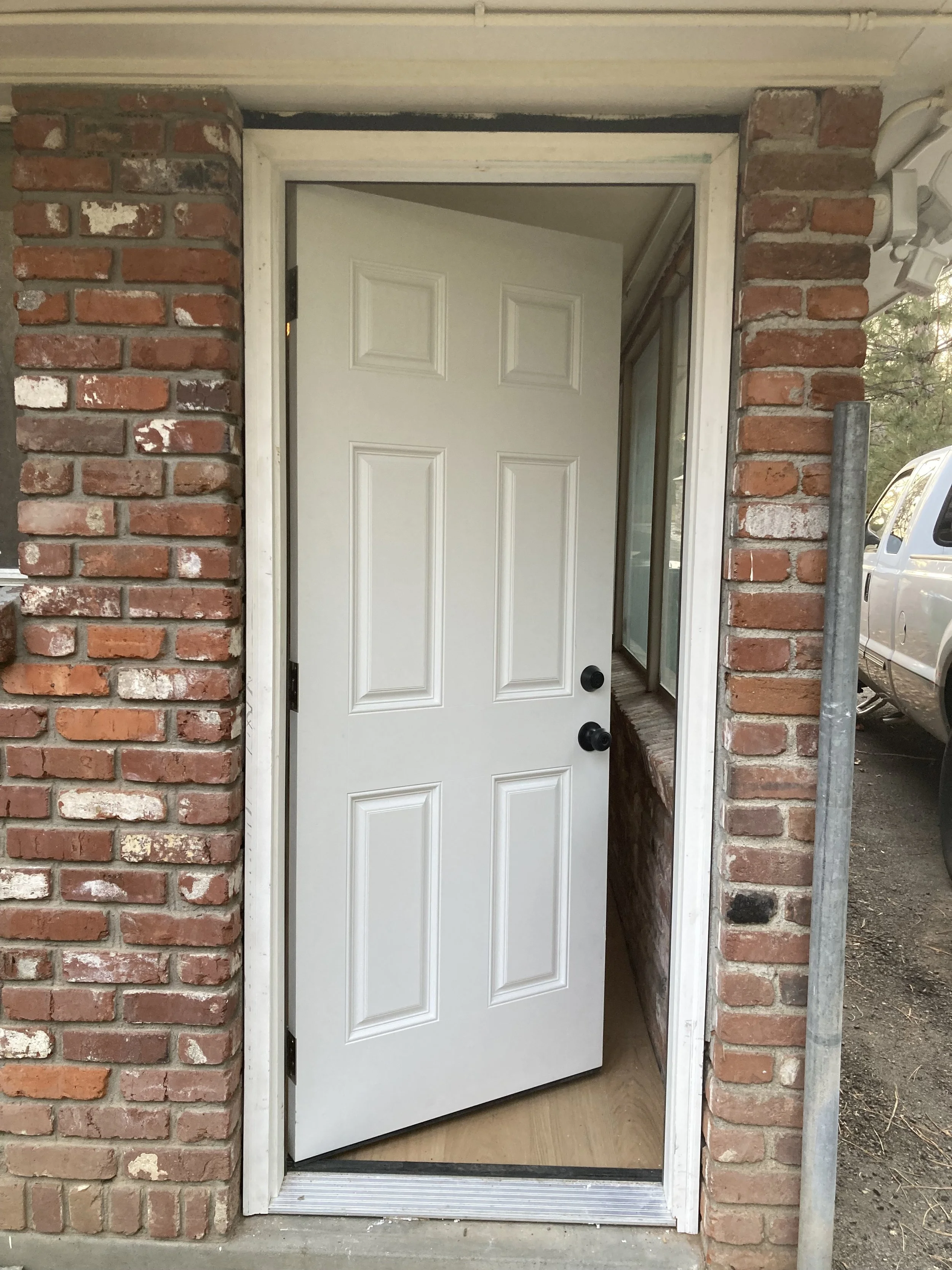 Replaced exterior door including the trim