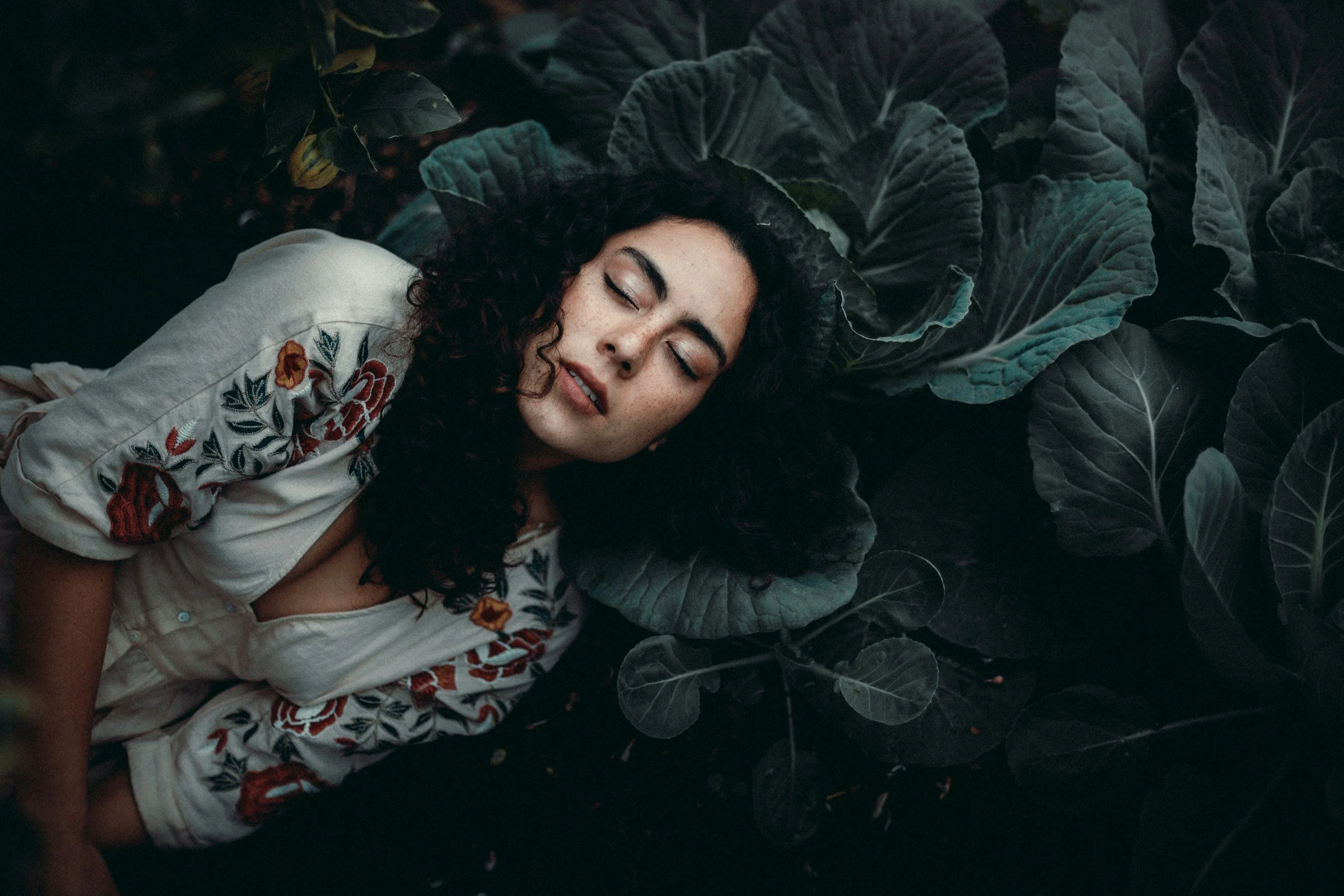 Peaceful sleeping woman representing natural sleep support through yoga during menopause and hormonal changes.
