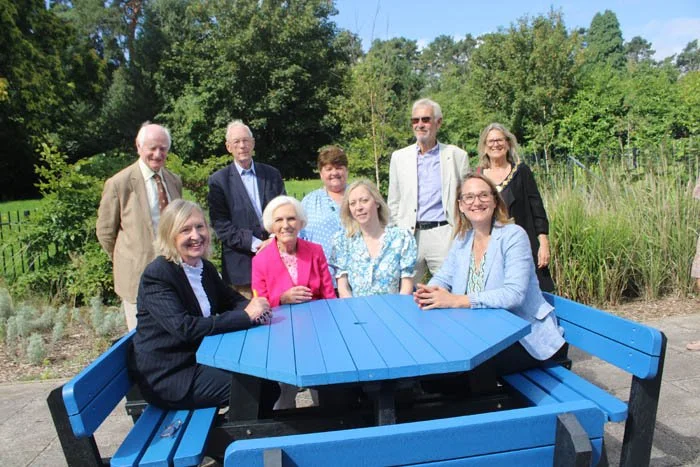 Dame Mary cuts ribbon - and cake - at unveiling of Outdoor Hospital Furniture 