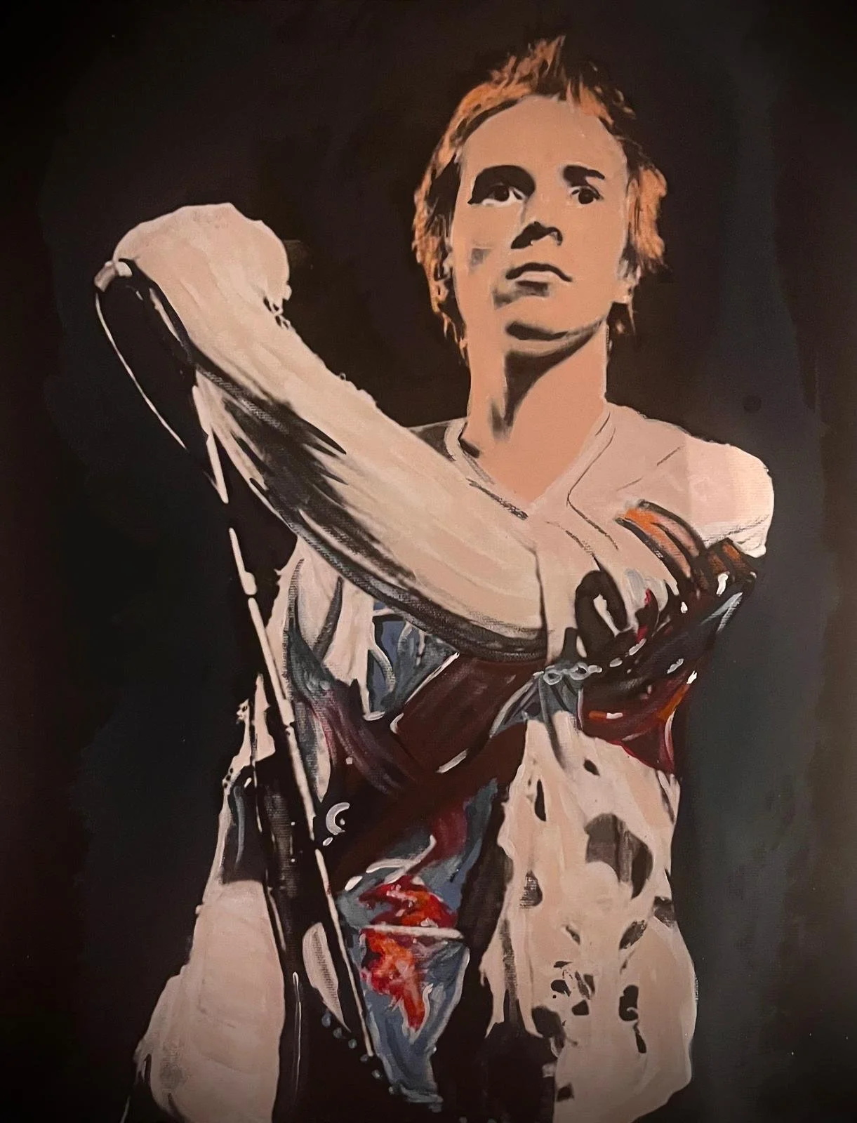 Painting of a female ice hockey player in uniform holding a hockey stick