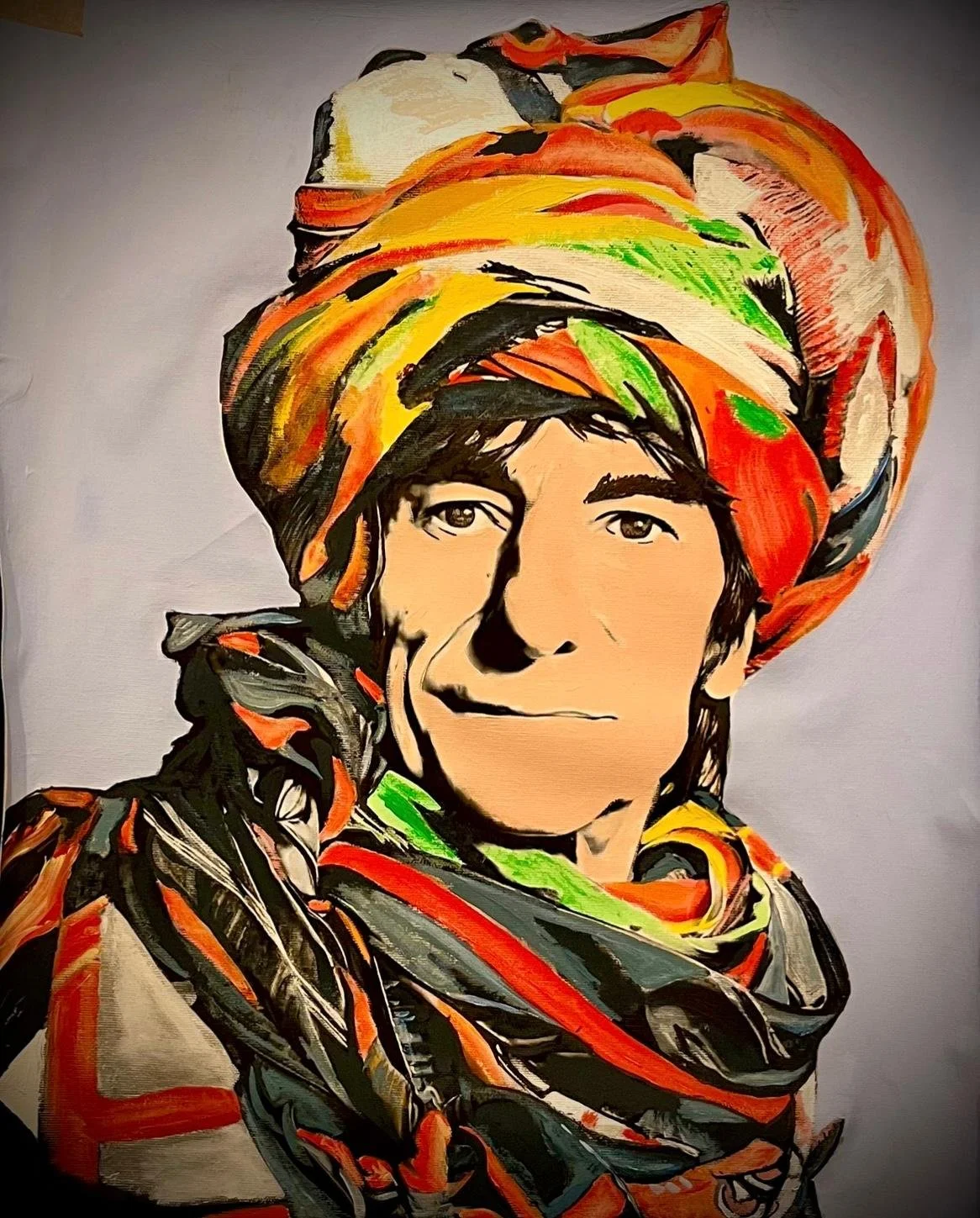 Painting of a woman wearing a colorful headwrap and scarf, with visible human features and artistic brushstrokes.