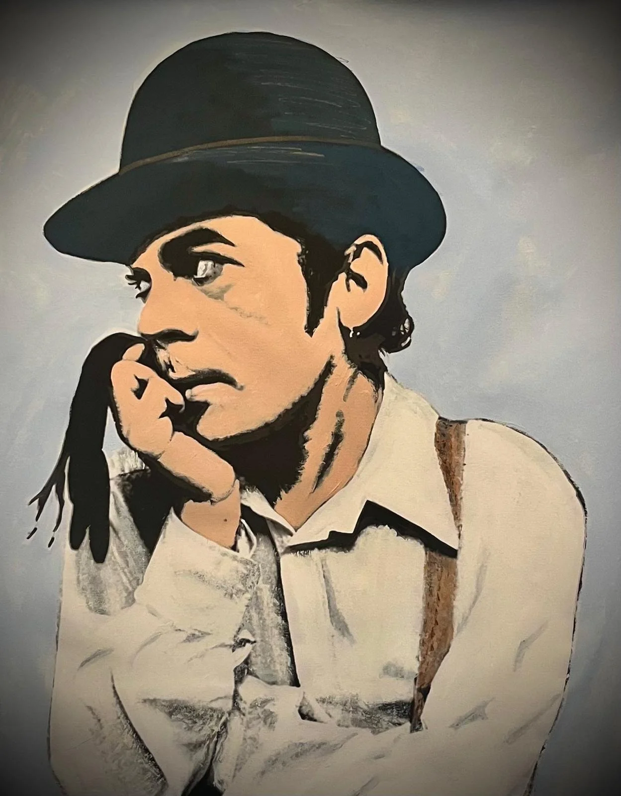 A painting of a person with dark hair, wearing a black bowler hat, a beige shirt, and suspenders, resting their chin on their hand with a thoughtful expression.