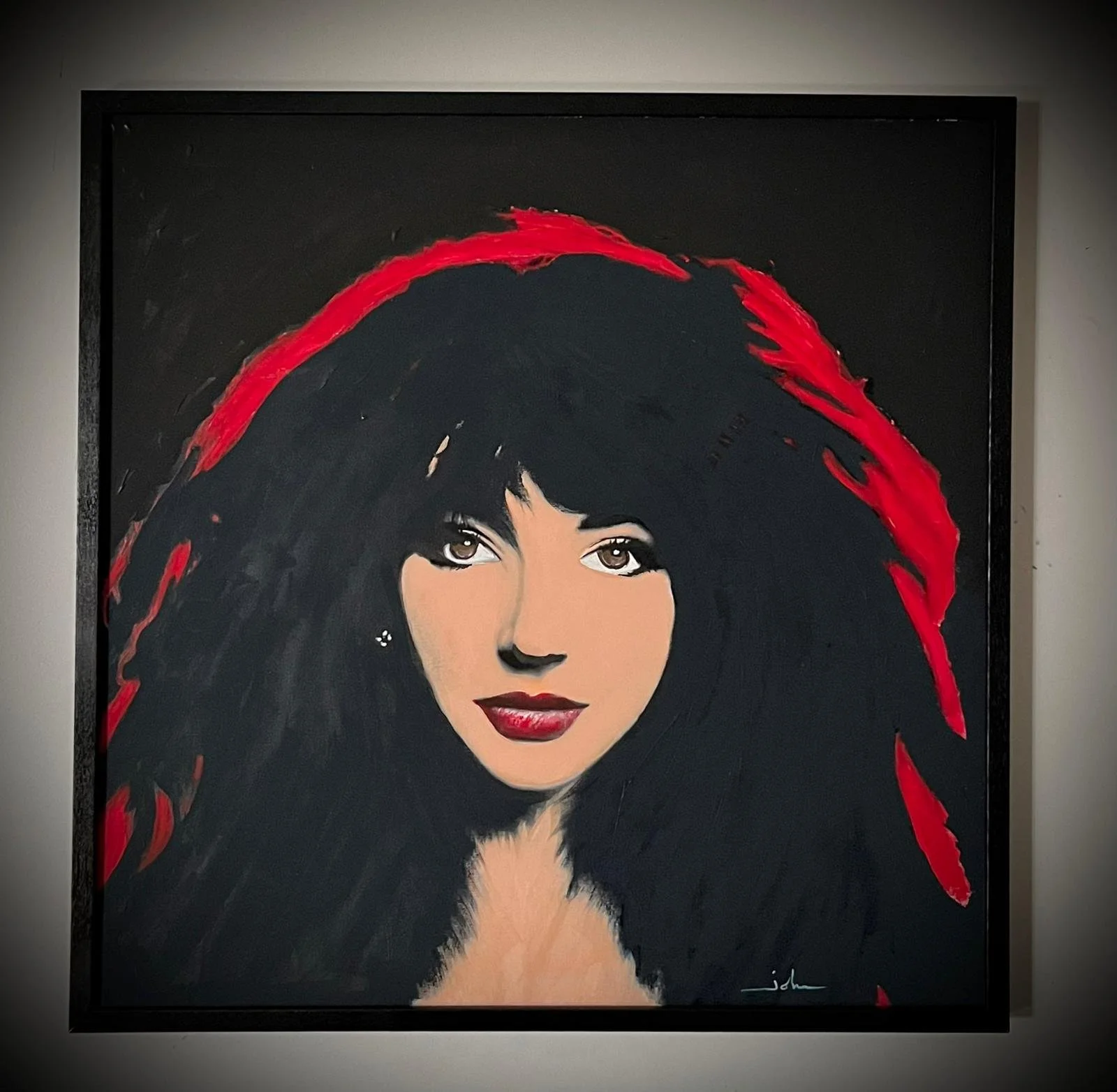Painting of a woman with dark hair, brown eyes, red lipstick, and a black and red headdress or hair accessory on a black background.