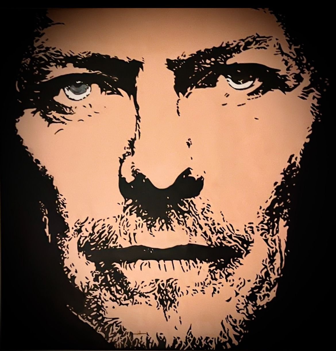 Close-up illustration of a man's face with glasses, beard, and mustache, in a stylized artistic style.