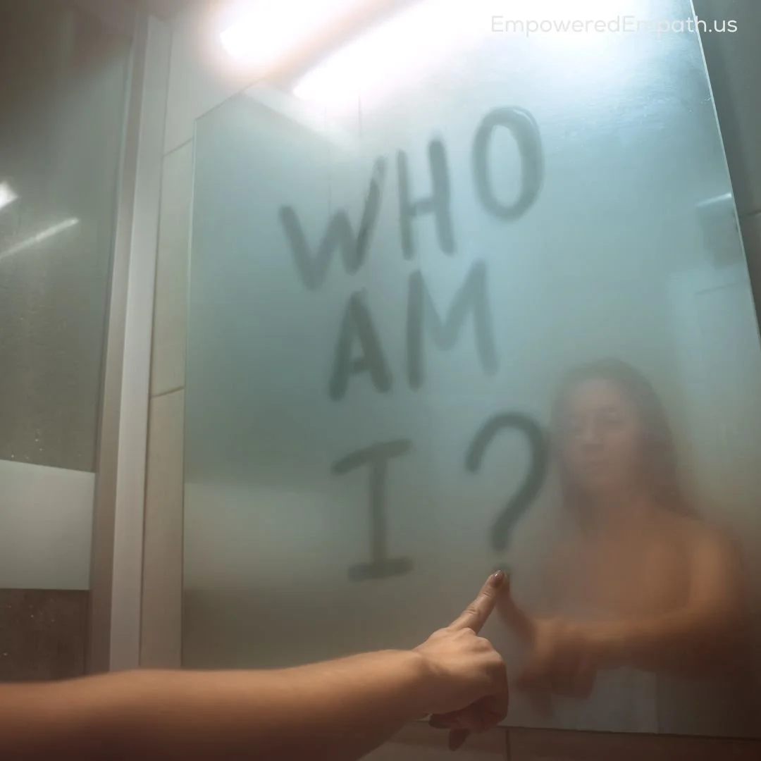 Woman writing "who am I?" on foggy mirror representing identity loss in trauma bonding
