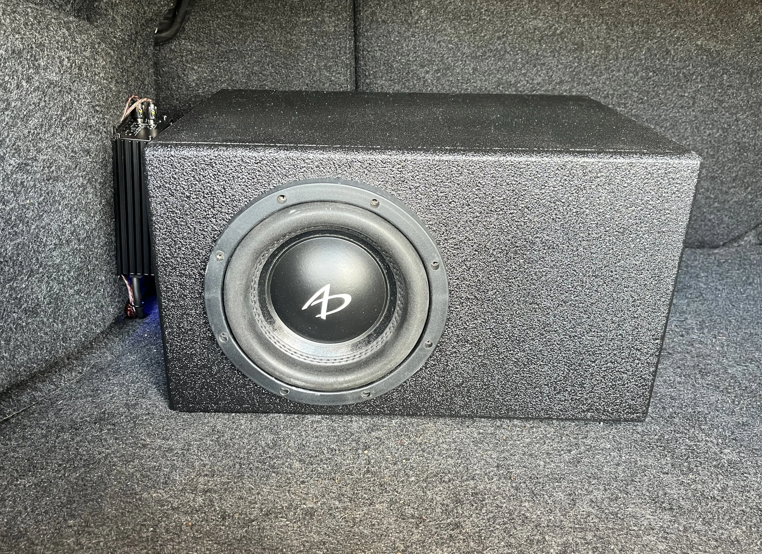 Enhance your car audio with a subwoofer and amp installation from Bronson Audio in Cenral FL. We expertly wire and install all components for a seamless look and powerful sound, so you can enjoy high-fidelity bass on every drive.