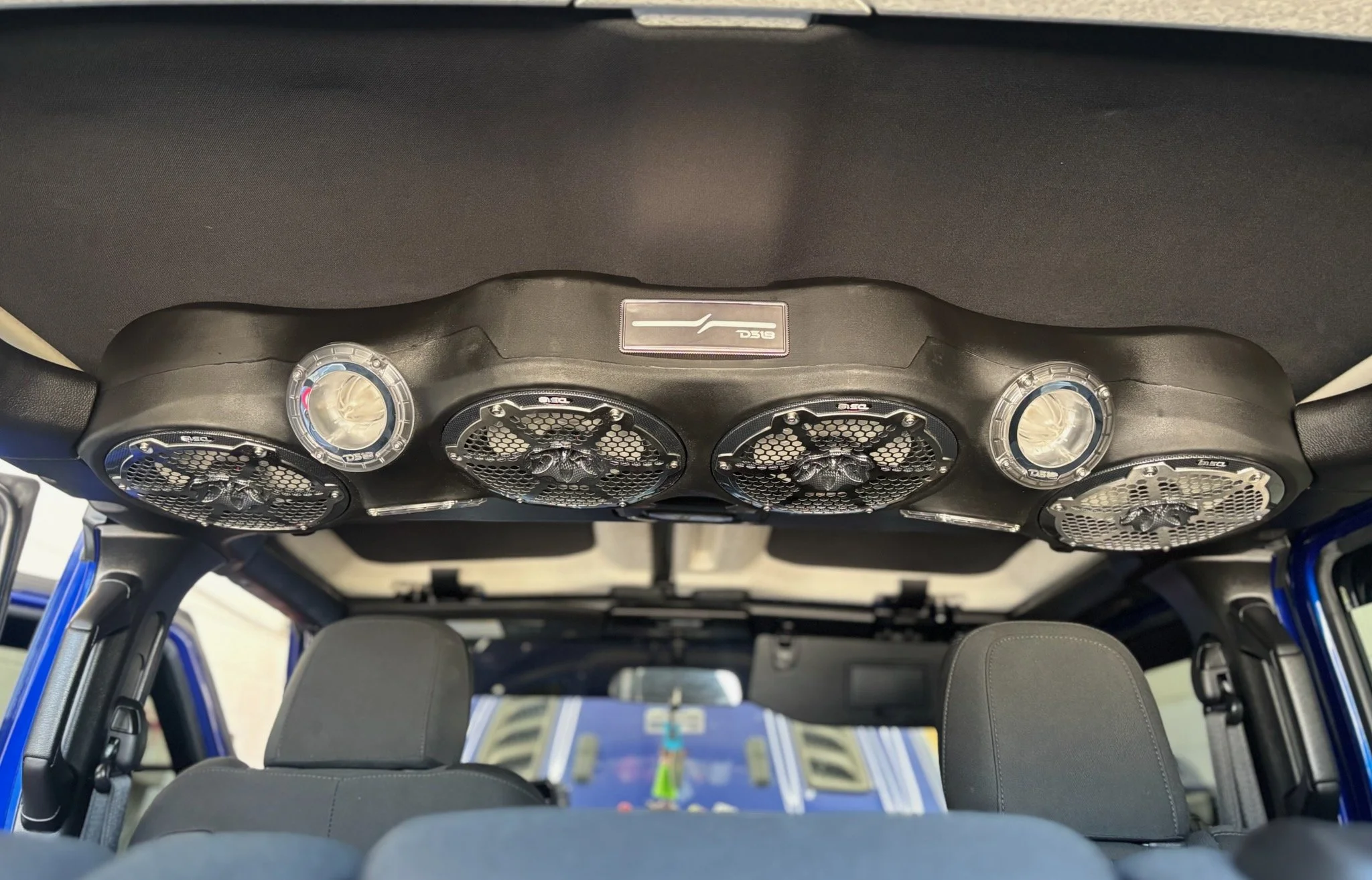 From the custom-built soundbar to the tremendous bass from the dual 12-inch subs powered by three DD Audio SS amps, this is a showpiece build. We ensure a clean install with blue accents and incredible sound quality. Get your dream audio system built