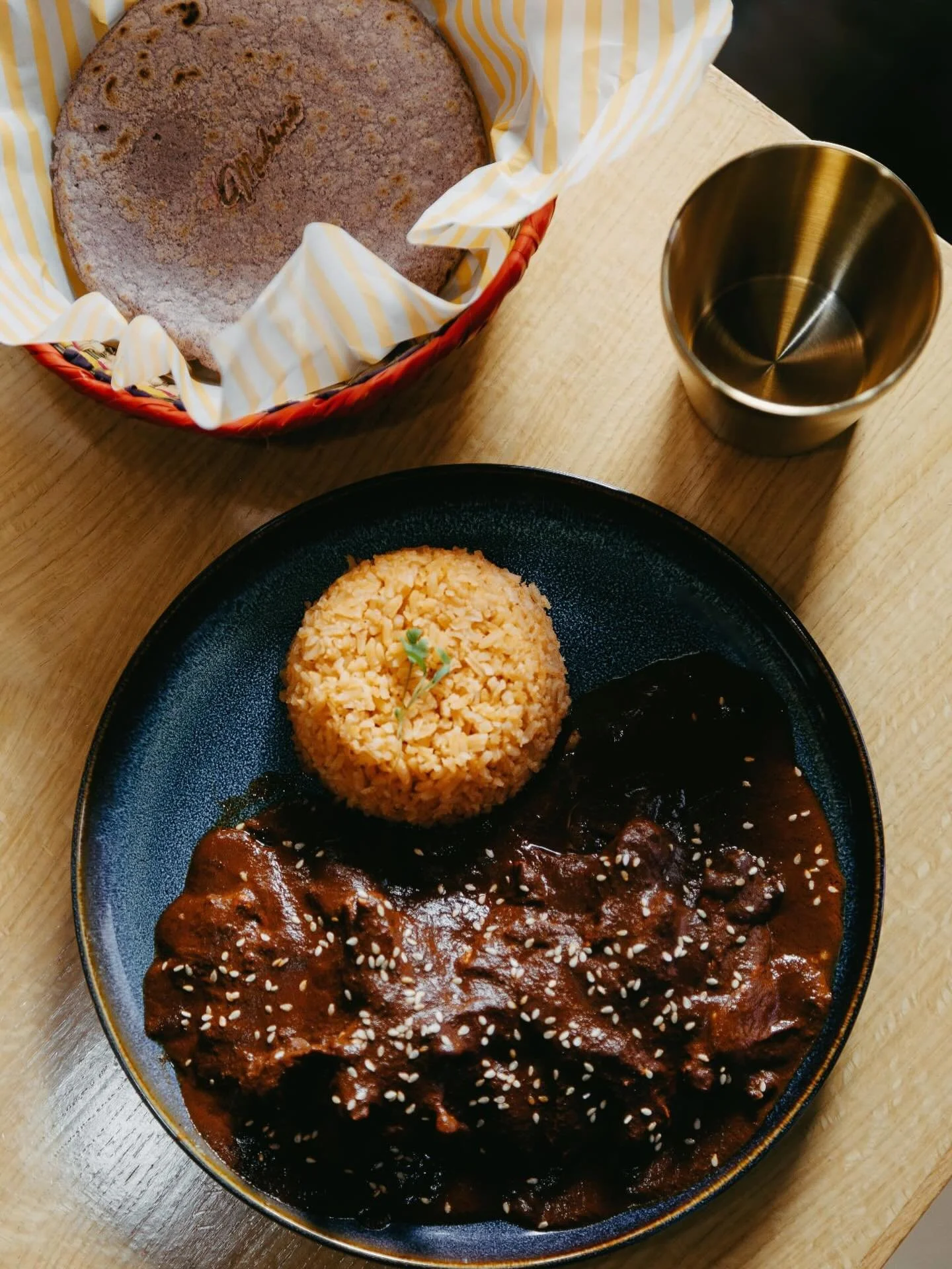 Dinner should feel like home.
Come visit us and enjoy something truly authentic at the table &mdash; mole con pollo, rich, slow-simmered, and full of tradition. The kind of meal that reminds you of dinners your Madrina used to make, where every bite 