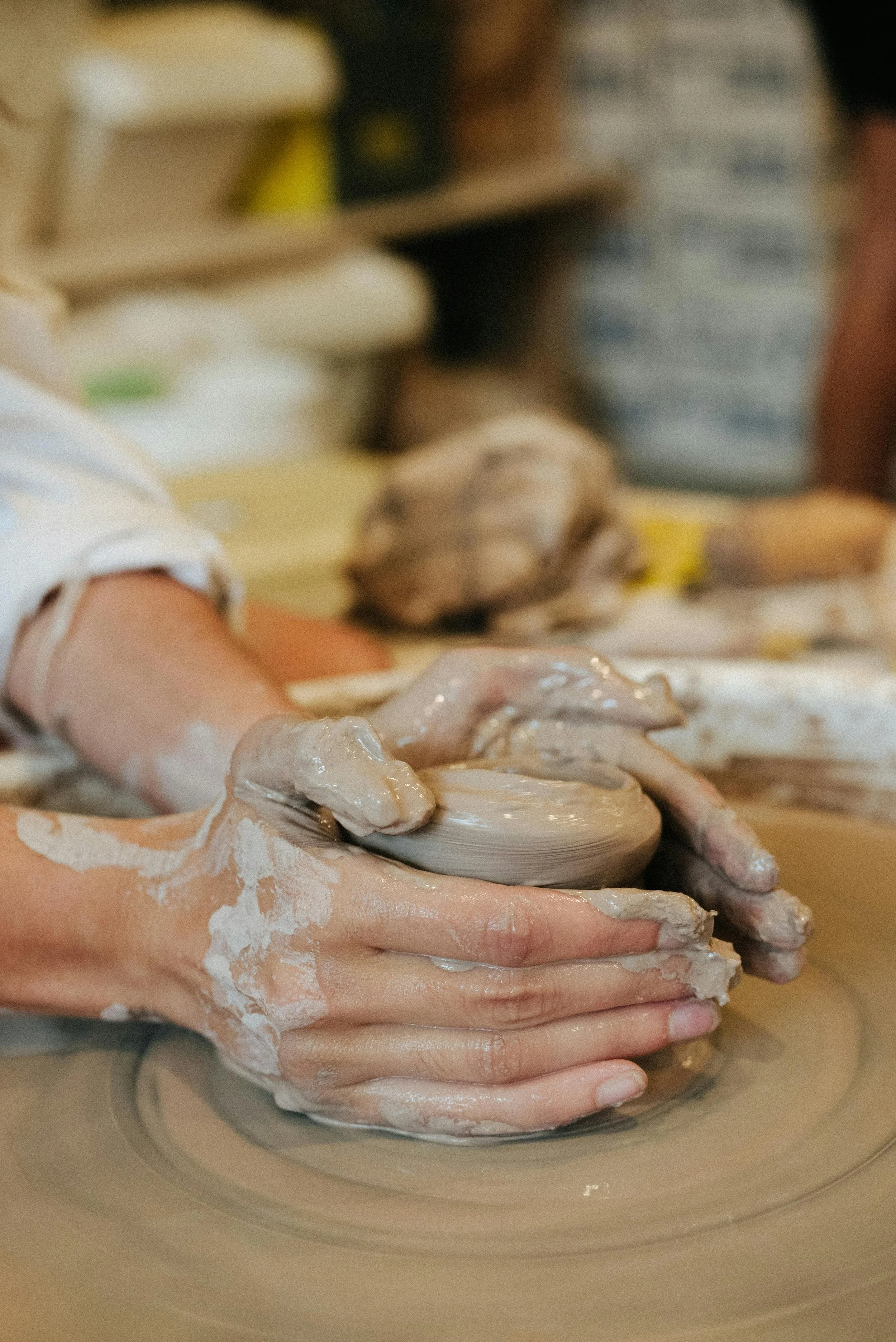 hands molding clay