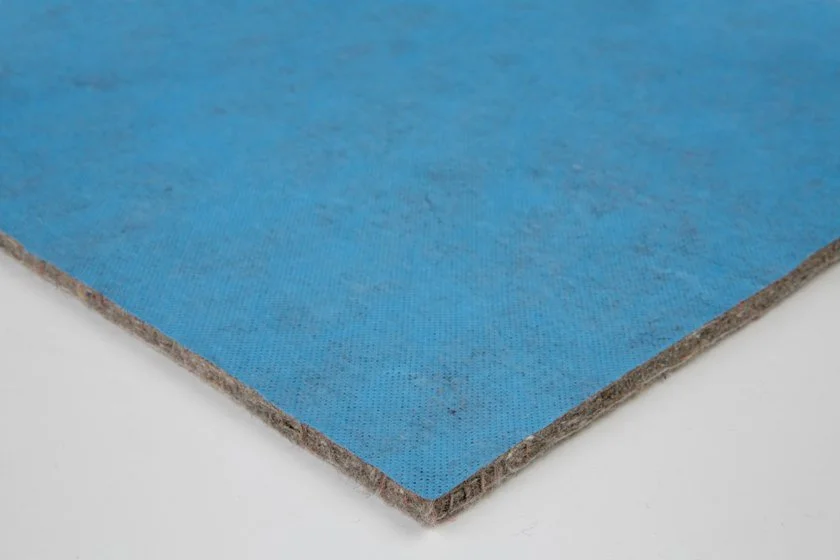 Close-up of a blue foam board with a textured surface and rough edges.