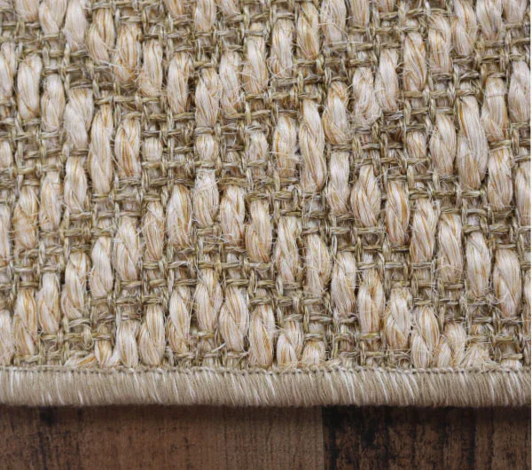 Close-up of a woven, textured fabric with beige and brown fibers.