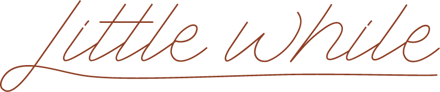 Close-up of the words 'little white' written in cursive script.