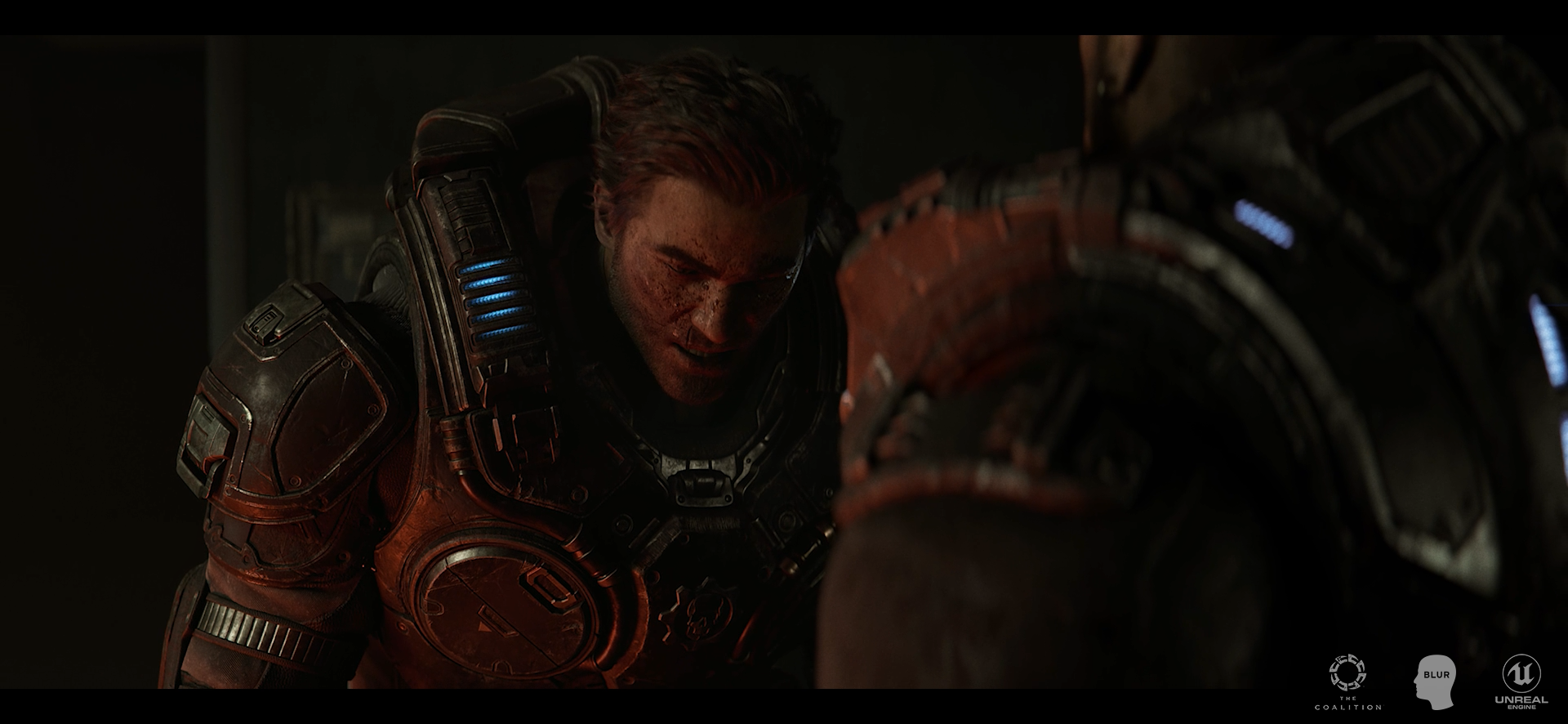 A soldier in advanced combat armor with a bloodied face is leaning over another armored figure in a dark environment, intense scene from a sci-fi action setting.