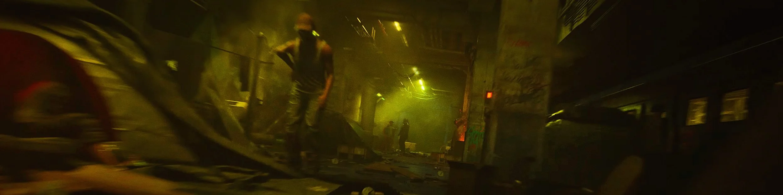 Dimly lit scene with people standing amidst debris and damaged infrastructure, possibly after a disaster in an urban area.