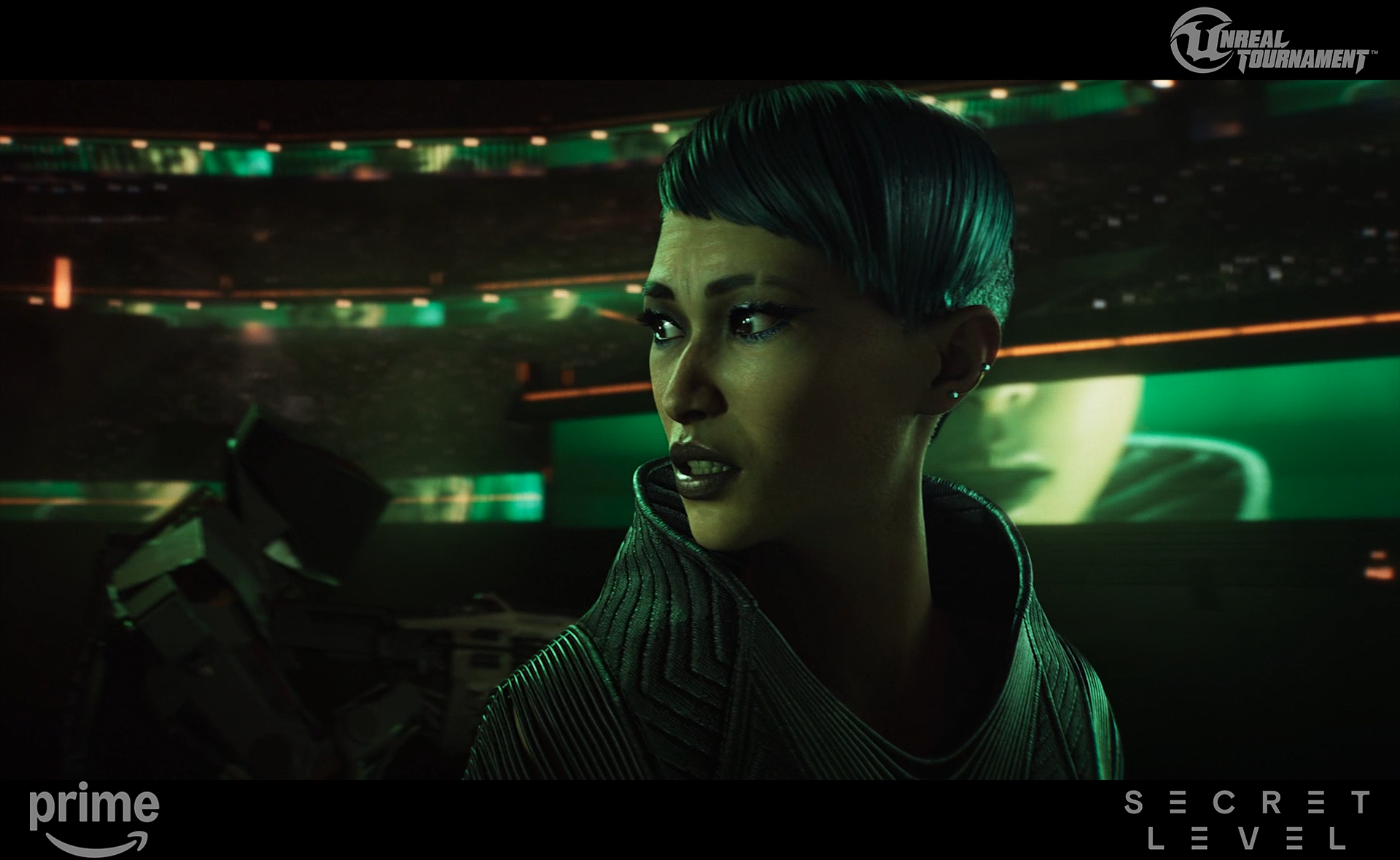 A woman with short blue hair and dark makeup in a futuristic setting with green lighting and a large video screen in the background