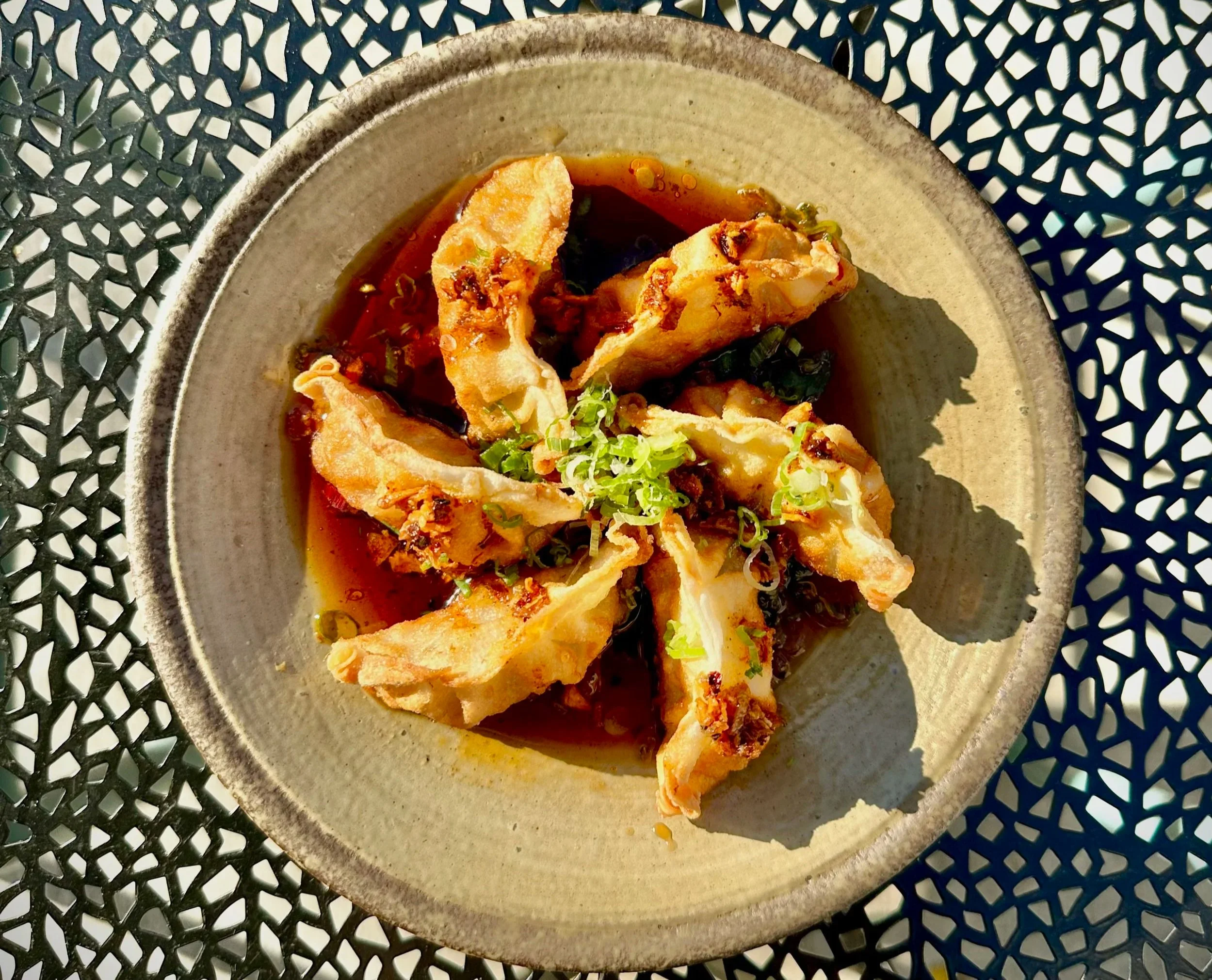 Handmade gyoza by TORA NY featuring Achilles Heat smoked chili crisp