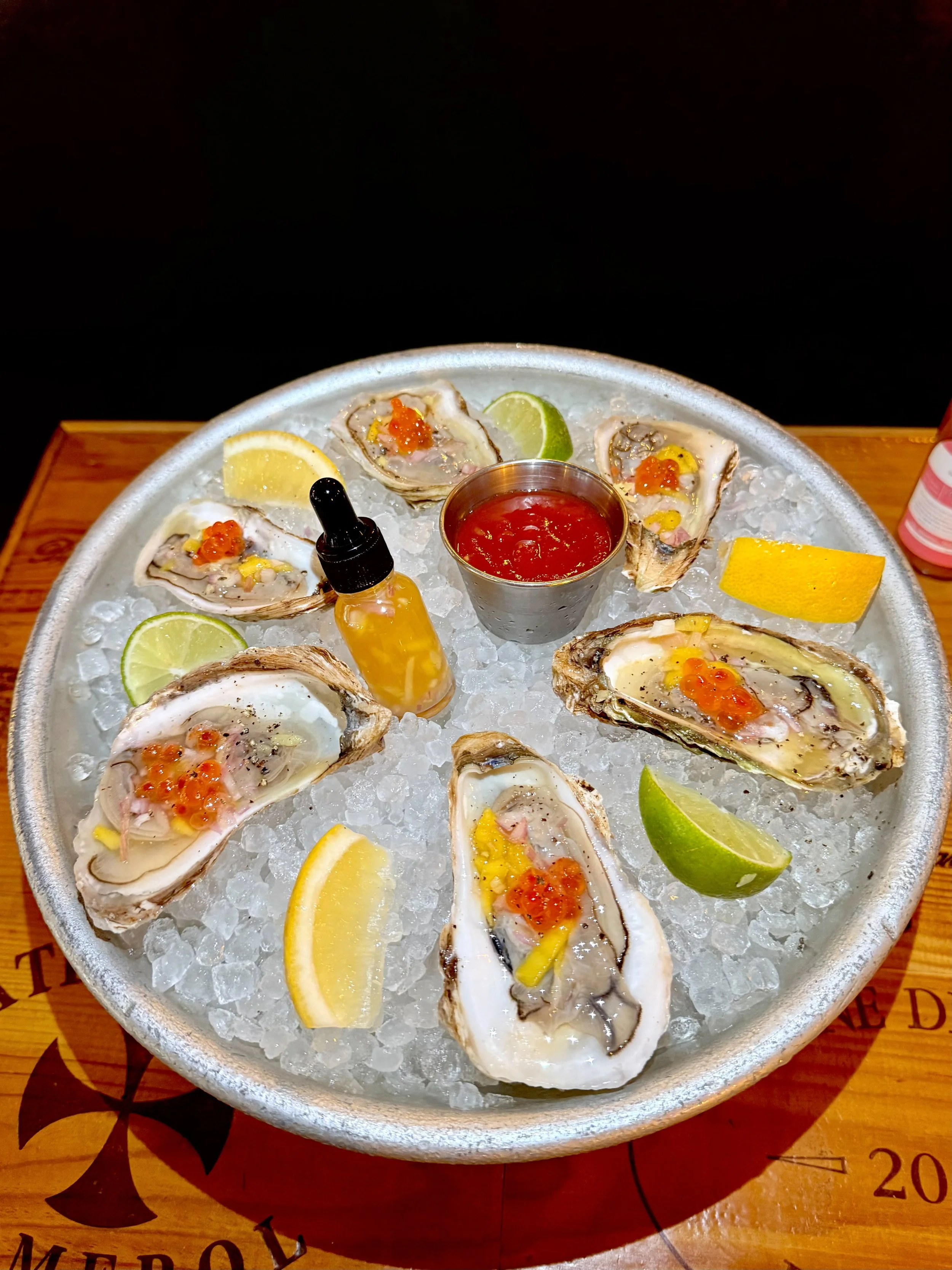 Smoke & Brine: Achilles Heat x Mominette Bistro, Fresh shucked malpeques dressedin a special Achilles Heat Smoked Mango Habanero Mignonette, crowned with salmon roe