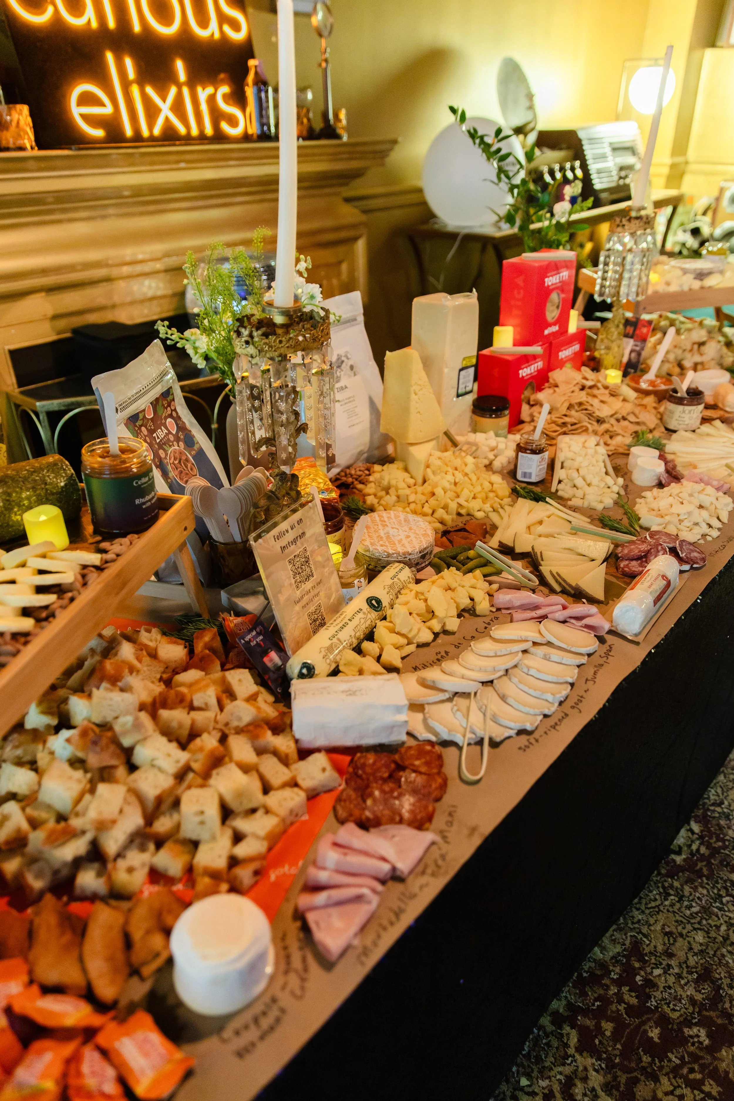 Achilles Heat Smoked Chili Crisp was a featured pairing at this incredible cheese and charcuterie table by The Metro Cheese Club x Curious Elixirs: The Great Curious Cocktail Party, Williamsburg, Brooklyn.