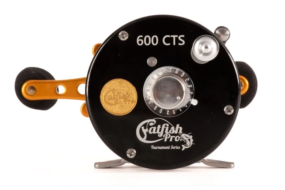 Close-up of a black and orange fishing reel with the brand name "Fatfish Pro" and model number "600 CTS" on it, part of the tournament series.