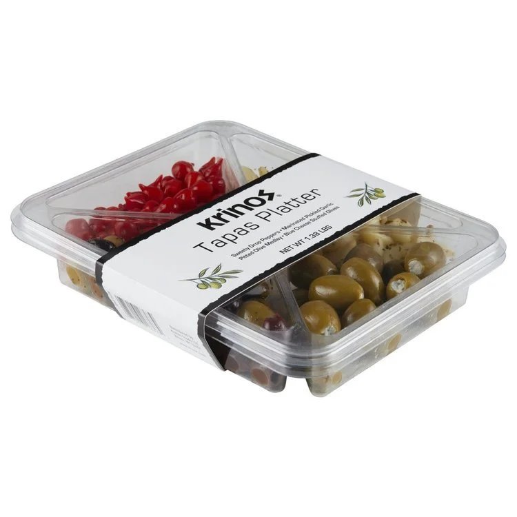 Krispy Tapas Platter with red and green olives in a plastic takeout container.