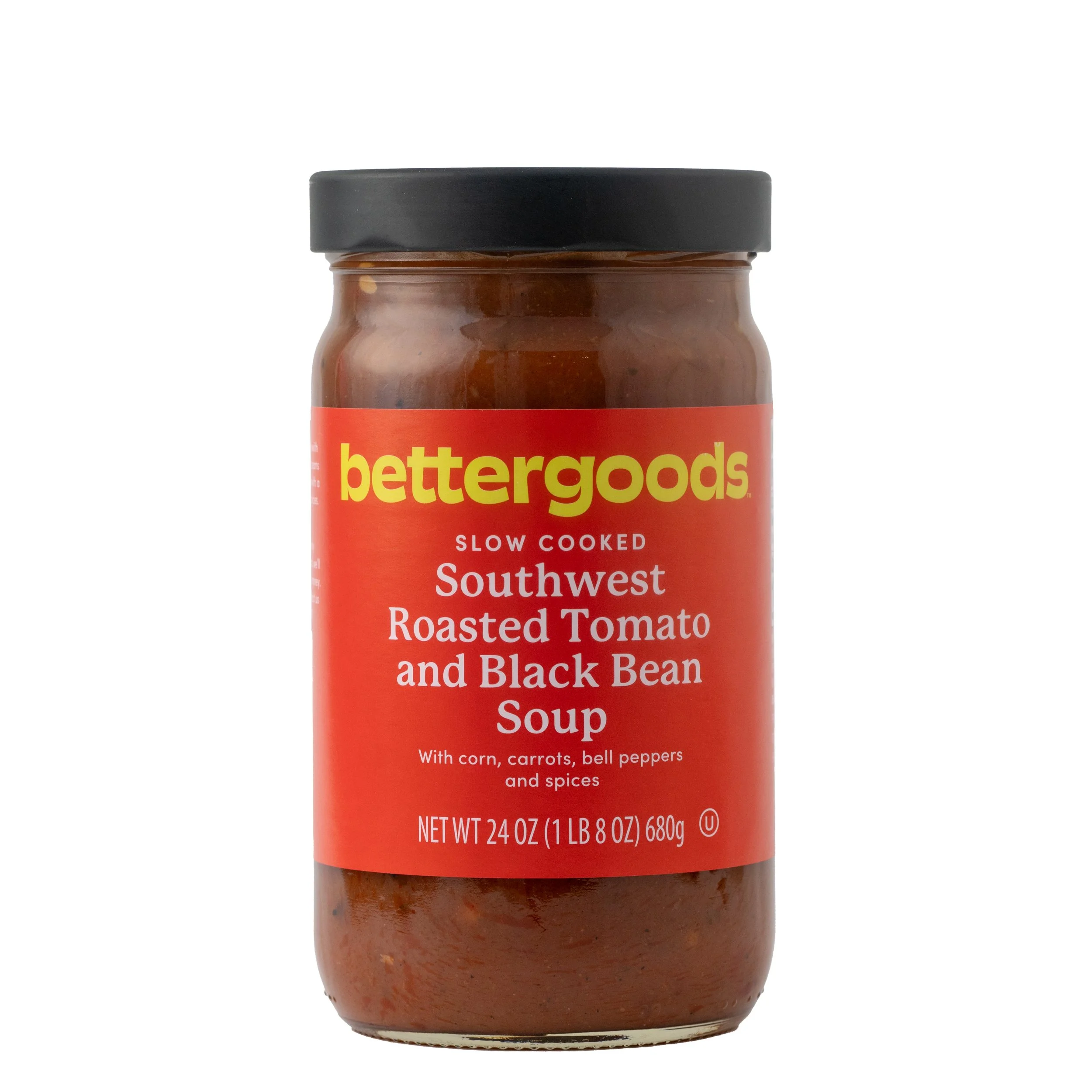 A jar of Better Goods Southwest Roasted Tomato and Black Bean Soup with a black lid and a red label featuring yellow and white text.