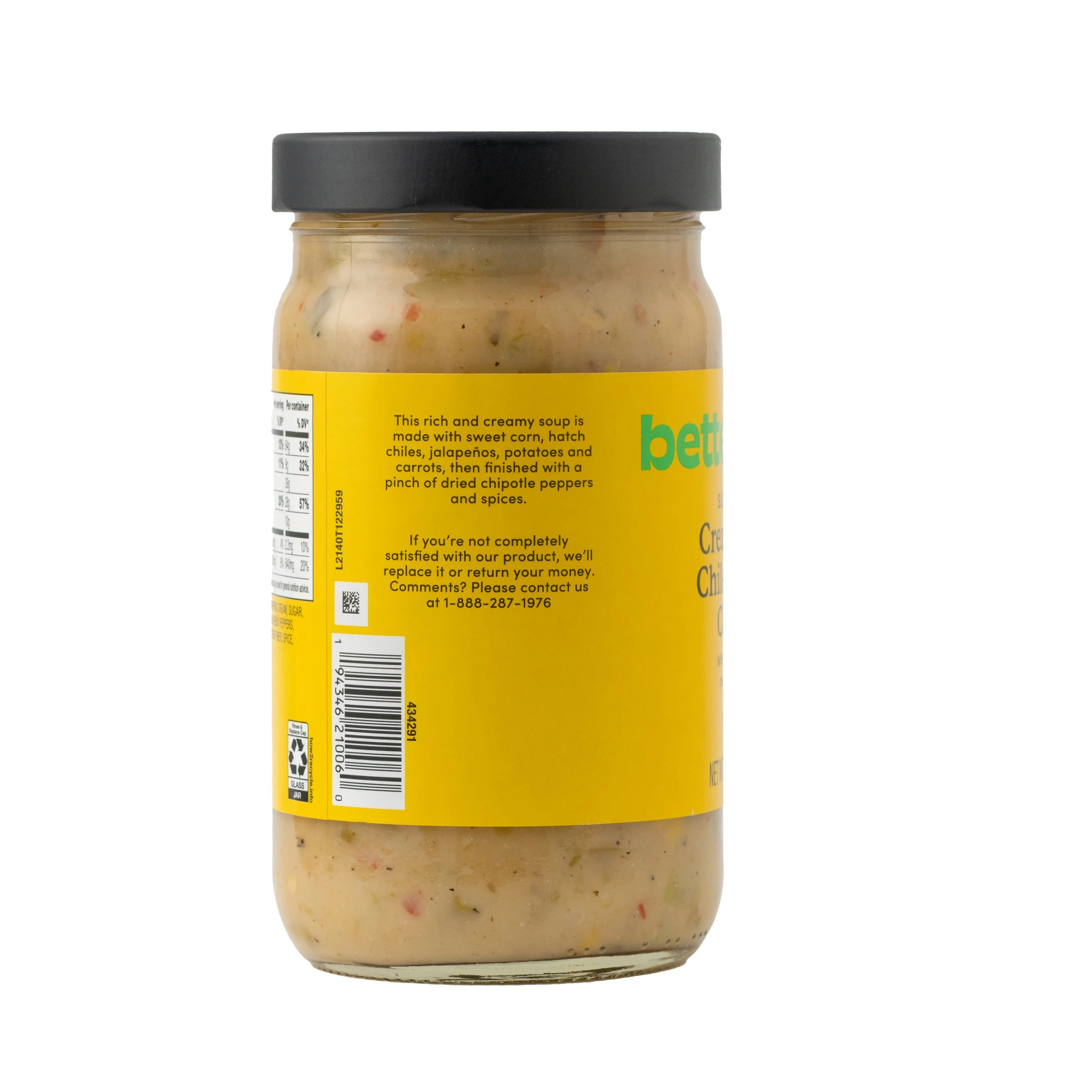 A jar of spicy chipotle chicken soup with a yellow label and black lid.