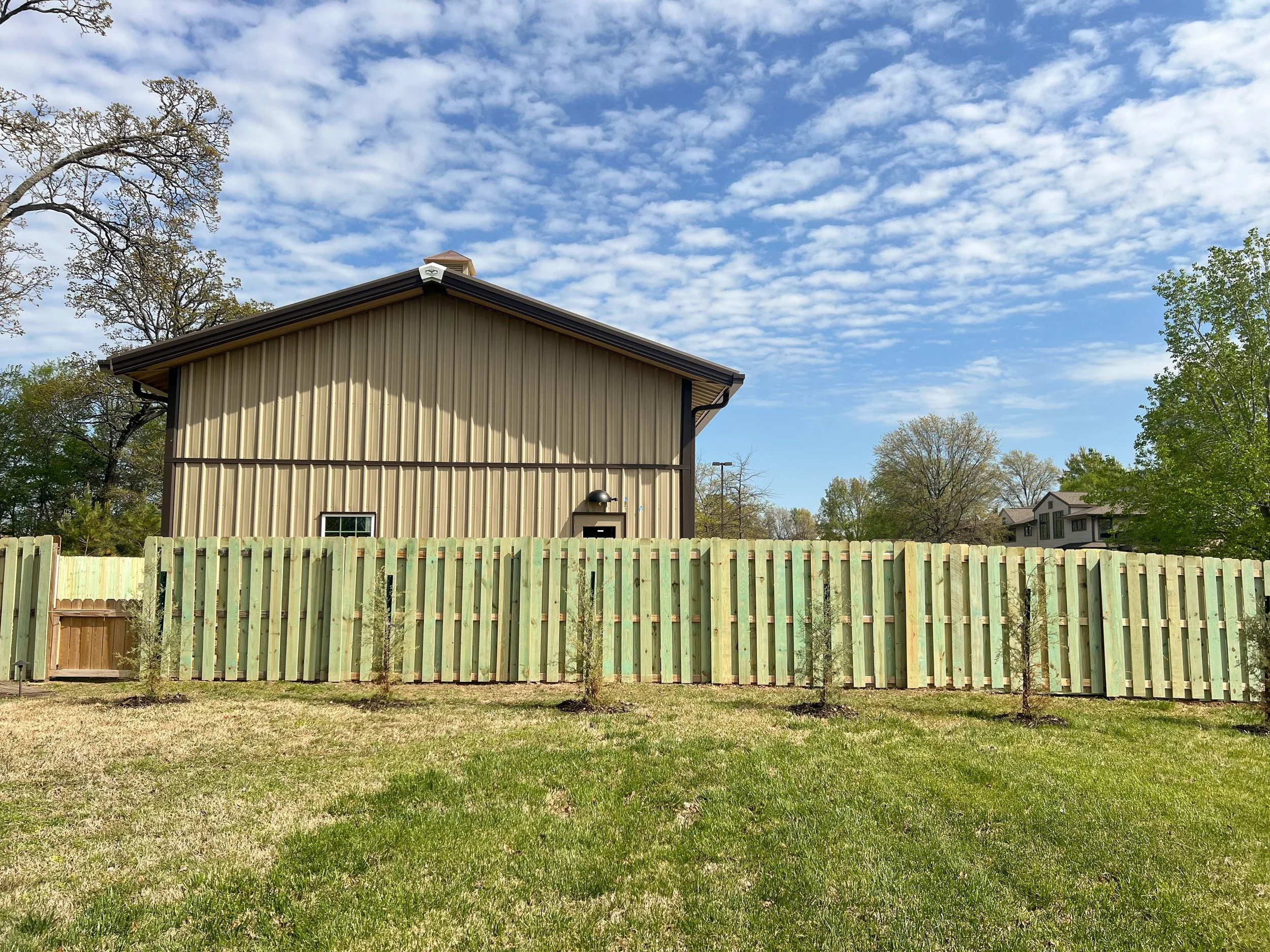 Shadowbox privacy fence with uniform picket layout - Fayetteville, AR