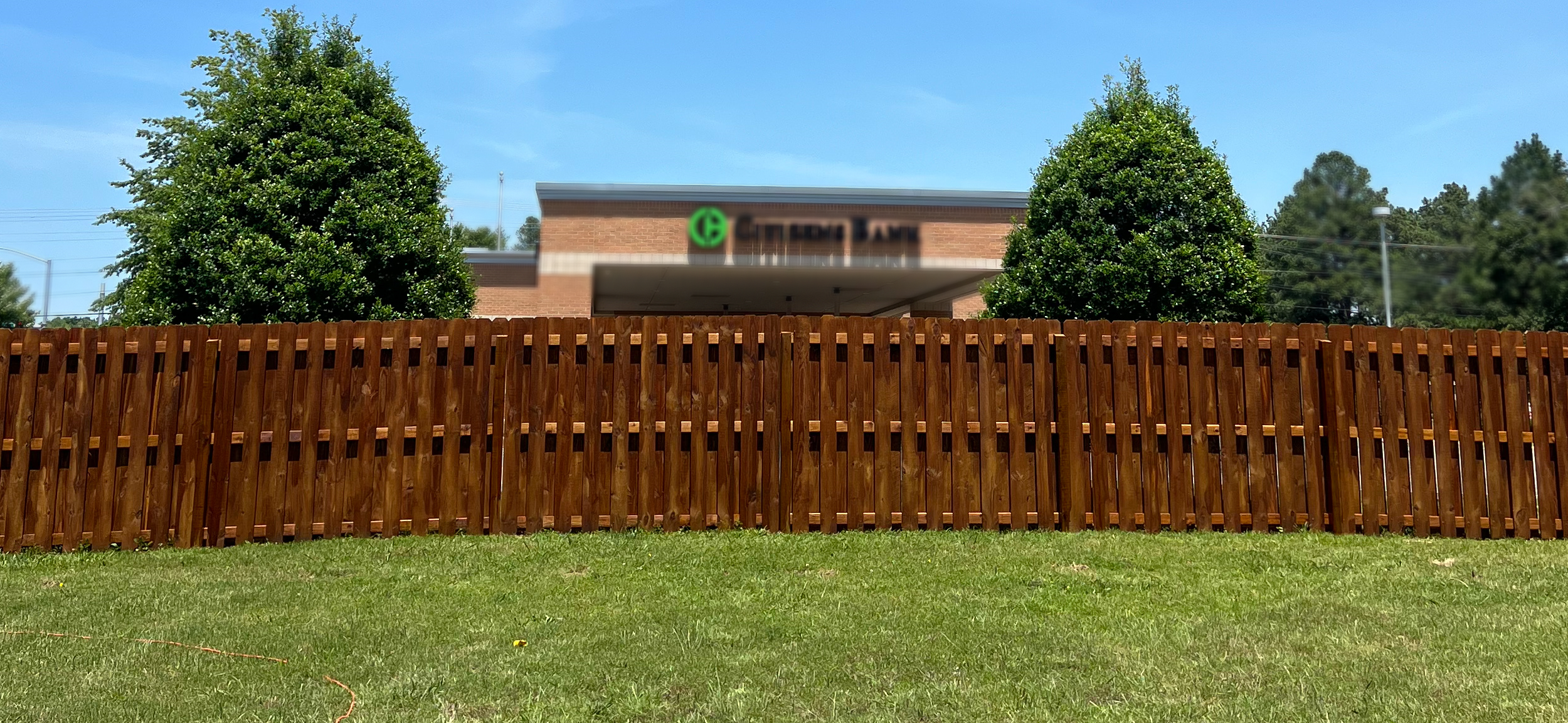 6ft wooden privacy fence, shadowbox, alternating pickets, stylish fence, fence staining Fayetteville, AR and NWA