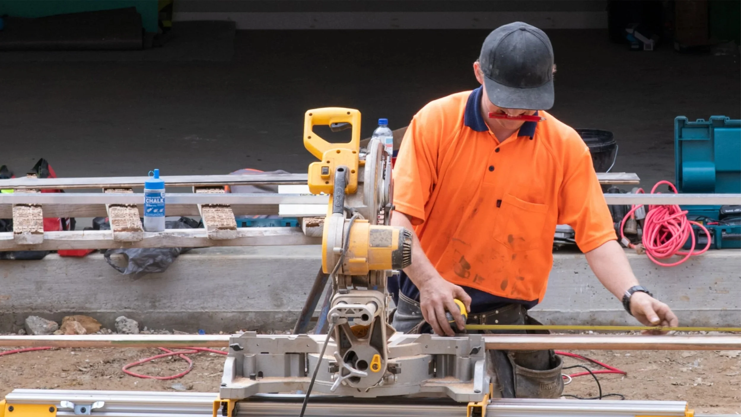 Oranssi carpenter using bench saw