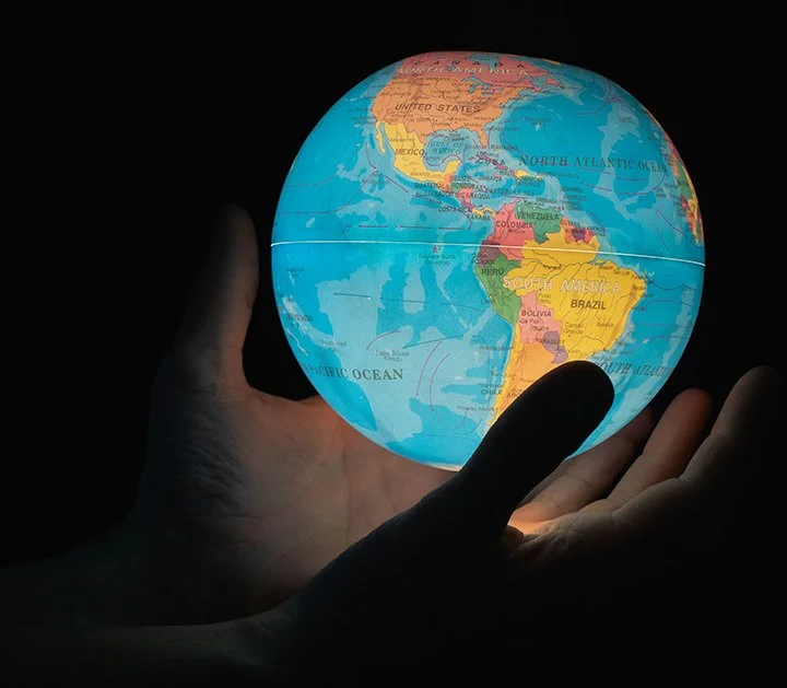 Glowing globe in hands