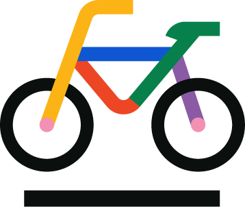 Colorful children's bicycle with a yellow handlebar, blue top tube, red down tube, green seat tube, purple fork, and black wheels.