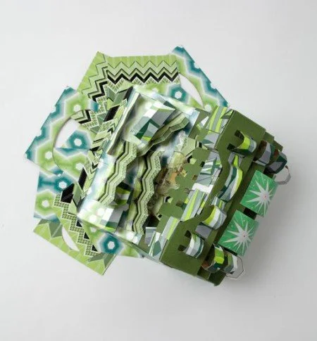 Green Machine , 2011, cardboard, glue, rivets, approx. 10 x 6 x 5 inches