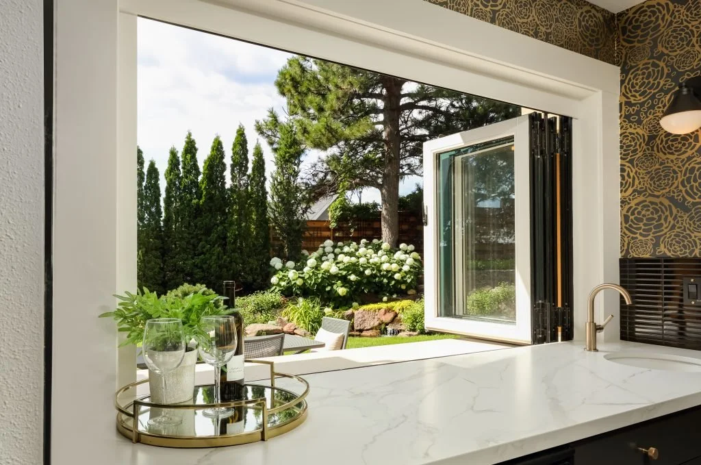 Custom bar with a passthrough window to manicured patio Boulder, CO