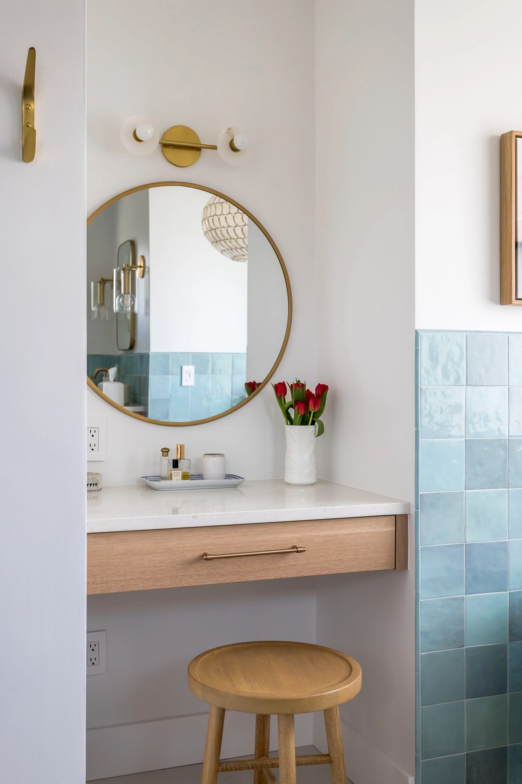 Designed for morning rituals and evening wind-downs, this custom-built makeup vanity pairs streamlined cabinetry with timeless details—because good design always includes a great mirror.