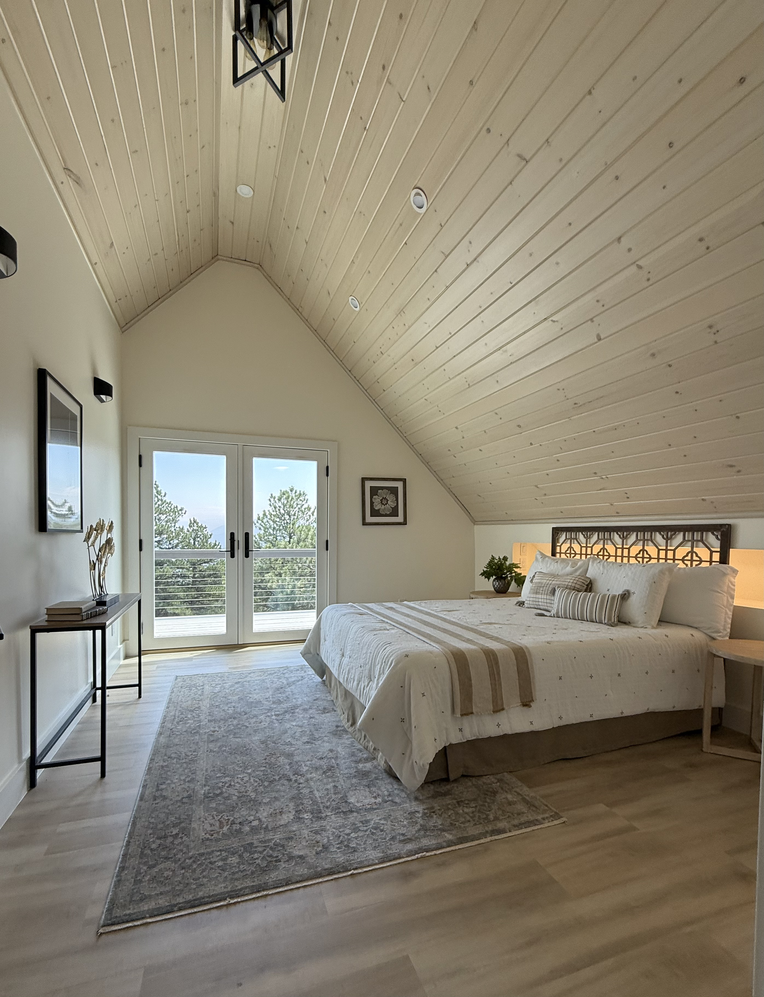 Primary bedroom with vaulted ceiling