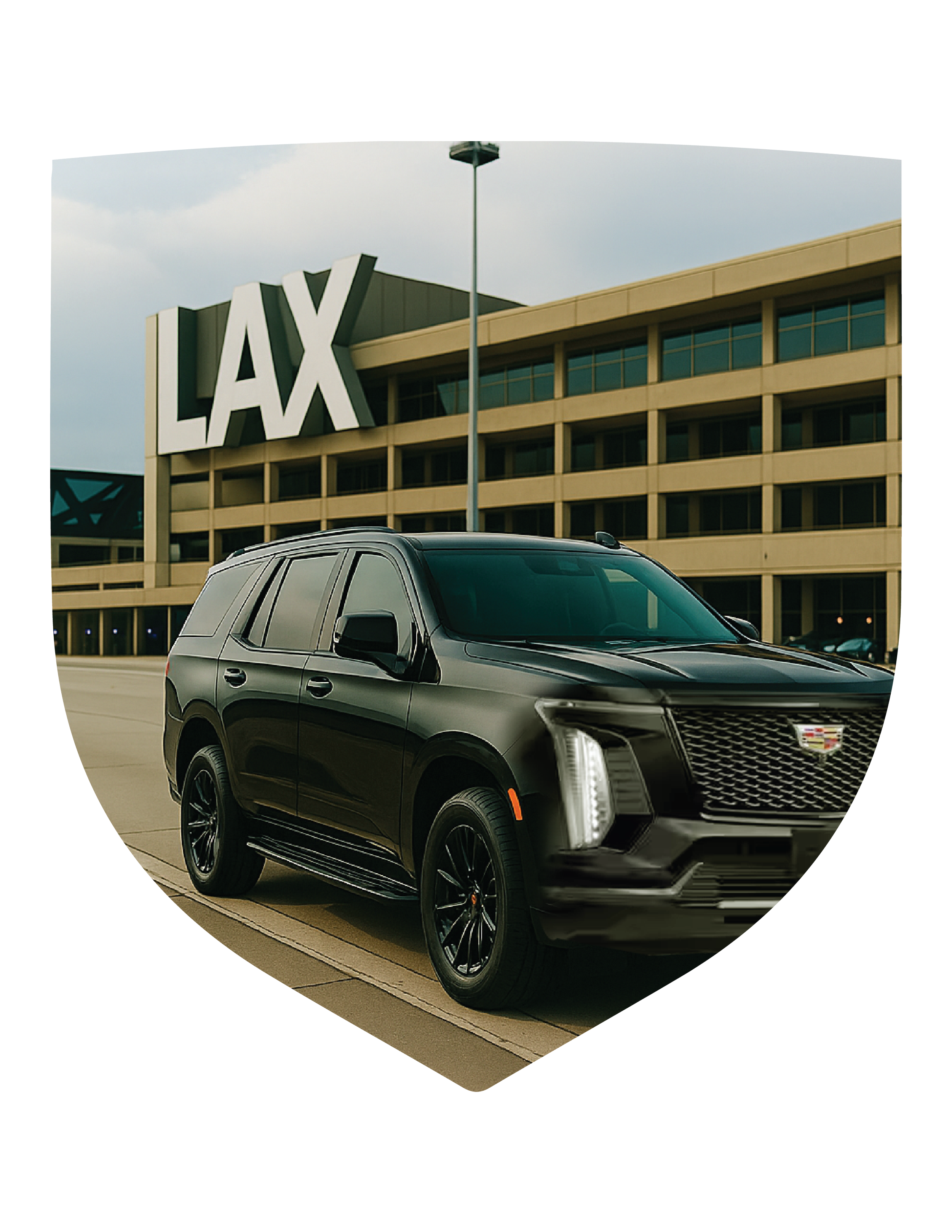 A black Cadillac SUV parked outside the LAX airport terminal.
