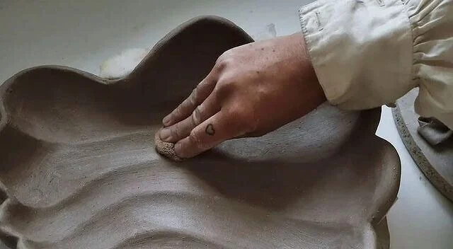 Hands building a ceramic pot with clay in Bozeman