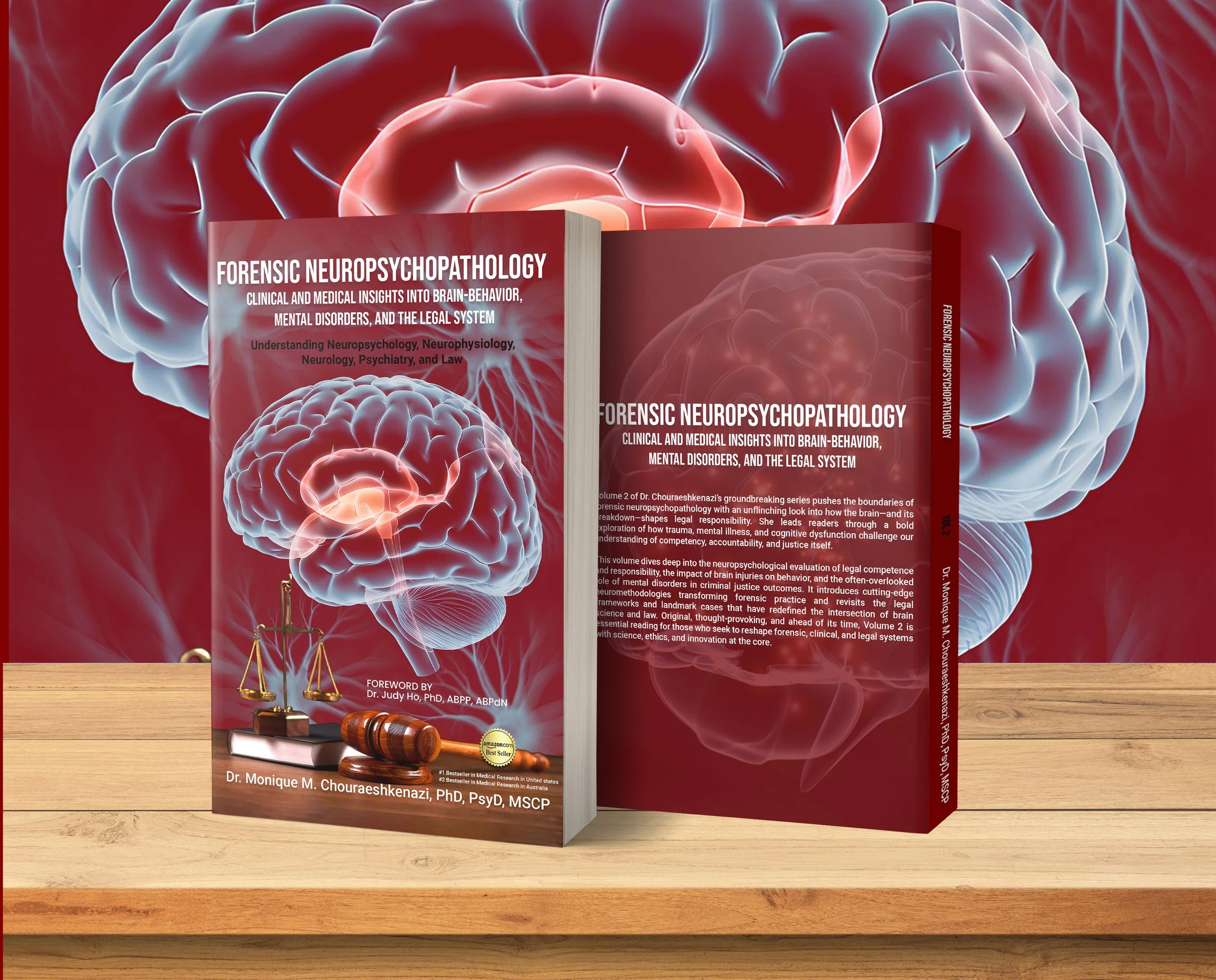 A book titled 'Forensic Neuropsychopathology' standing on a wooden surface with a red educational background featuring a large digital illustration of a brain. The cover shows a smaller brain illustration with a gavel and scales of justice, and foregrounded are a gavel, a legal scale, and a badge with an Amazon.com logo.