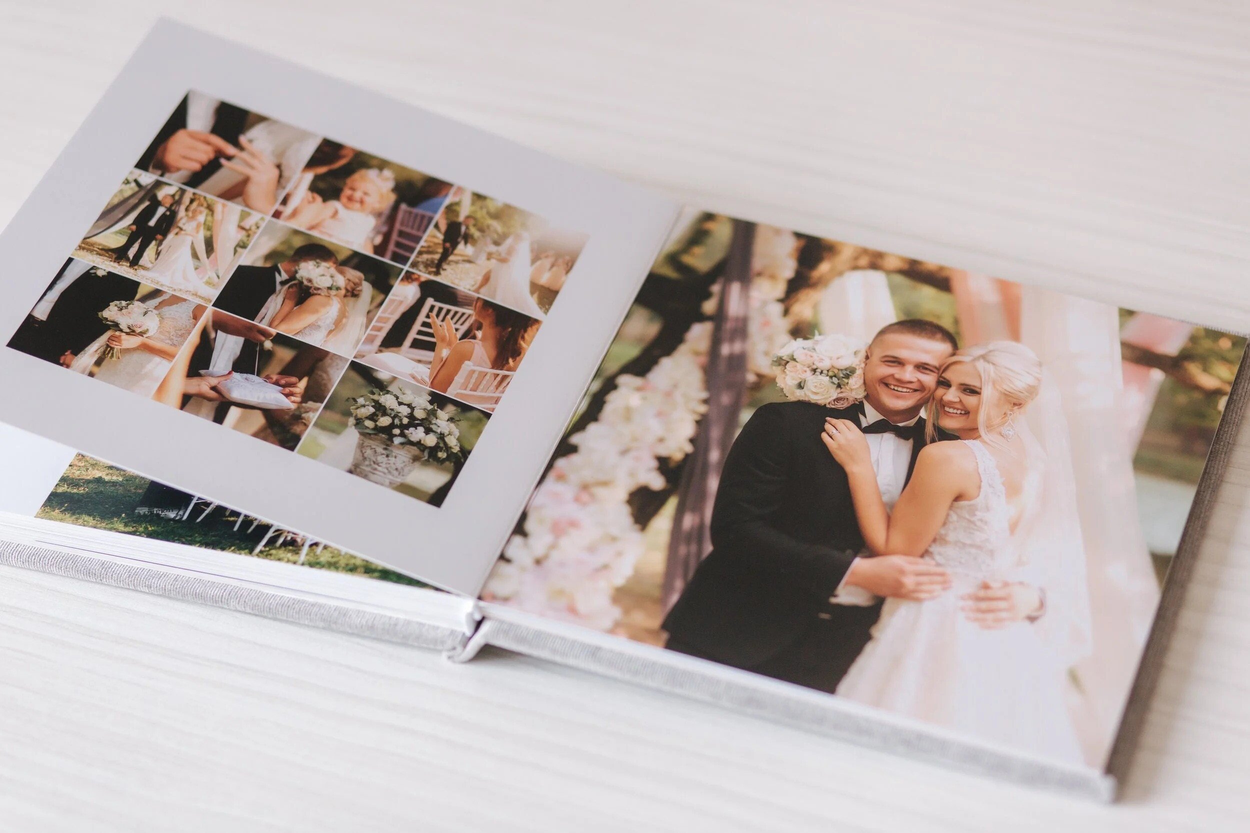 Open wedding photo album showing a bride and groom smiling outdoors, and a collage of wedding moments with flowers.