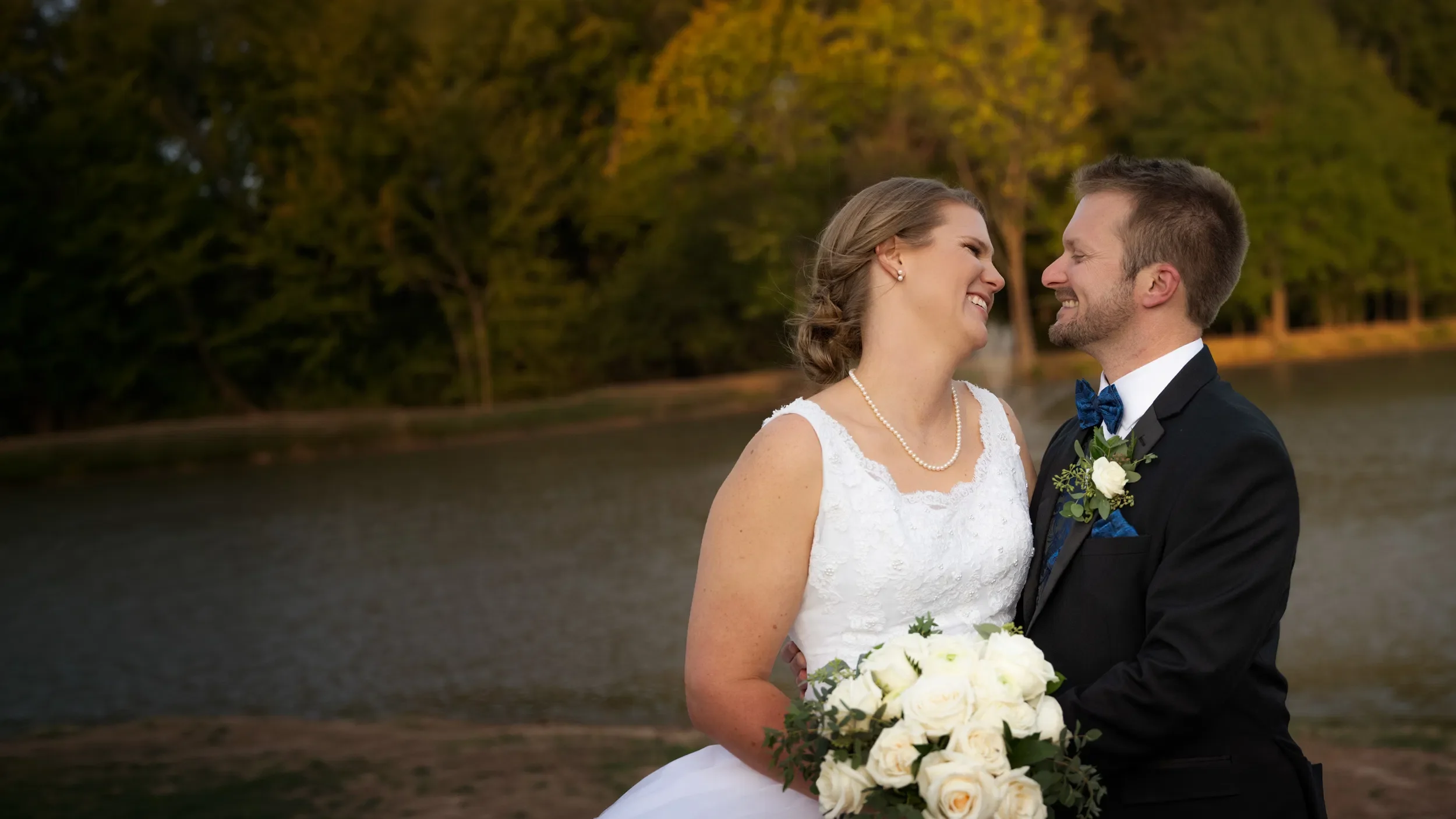 engaged couple embracing in soft urban light - cheap engagement photographers