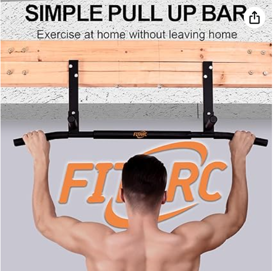 A person using a simple pull-up bar mounted on a wall, with instructions to exercise at home, in front of a sign that says 'FITTERC'.