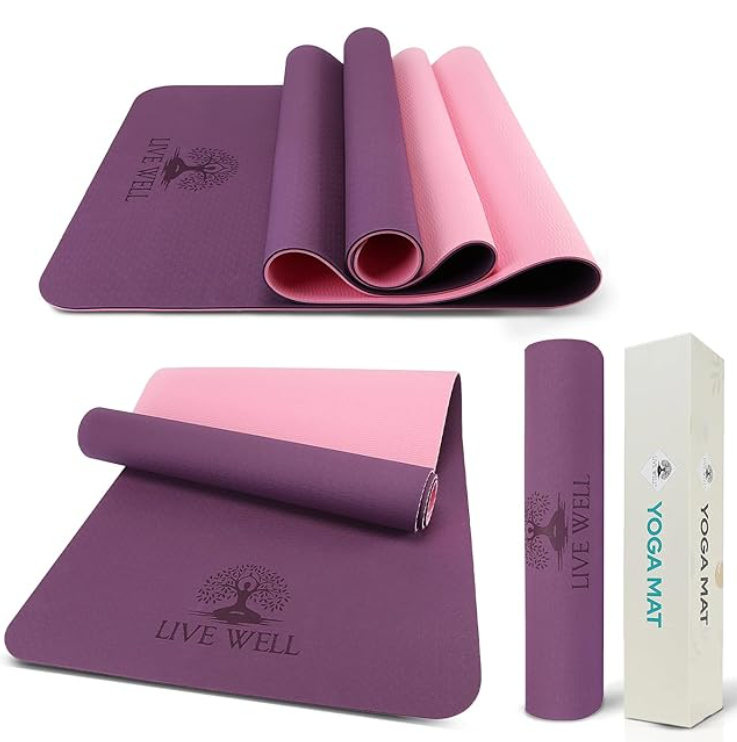 Set of two purple and pink yoga mats, one rolled up and the other unrolled, with a white box labeled "YOGA MAT," and a rolled purpleYoga mat with a "LIVE WELL" logo.