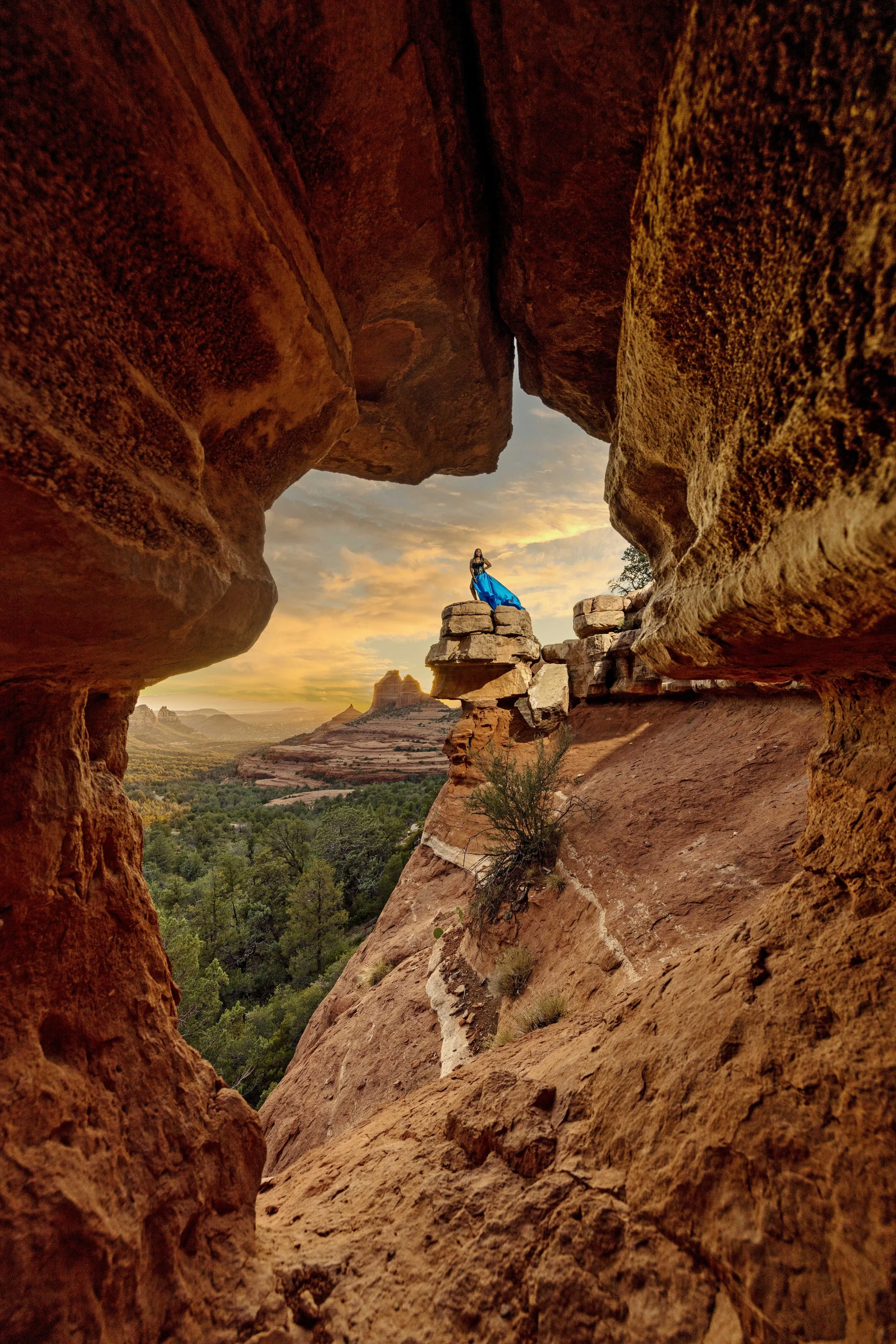 sunset flying dress portrait on the rocks of Sedona with clouds 