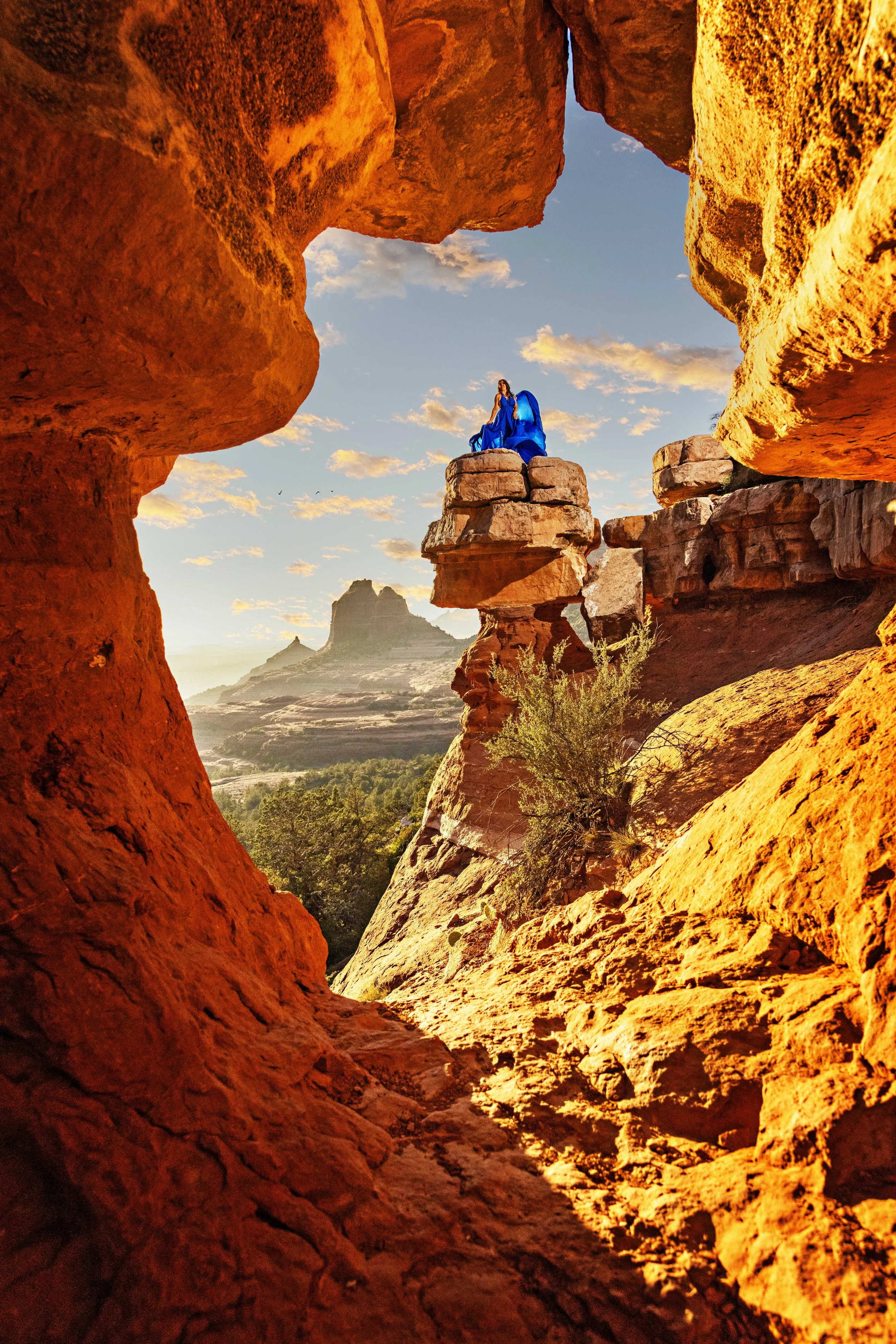 portrait of a birthday celebration on the rocks of Sedona in a blue flying dress