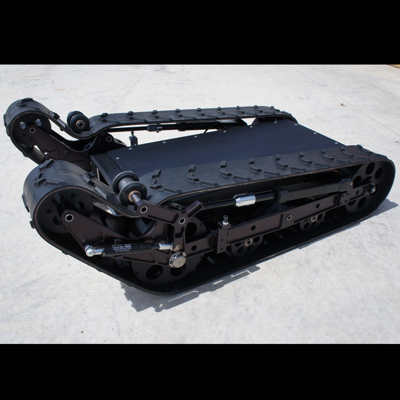 A black robot with shape-changing tracks and mechanical arms.